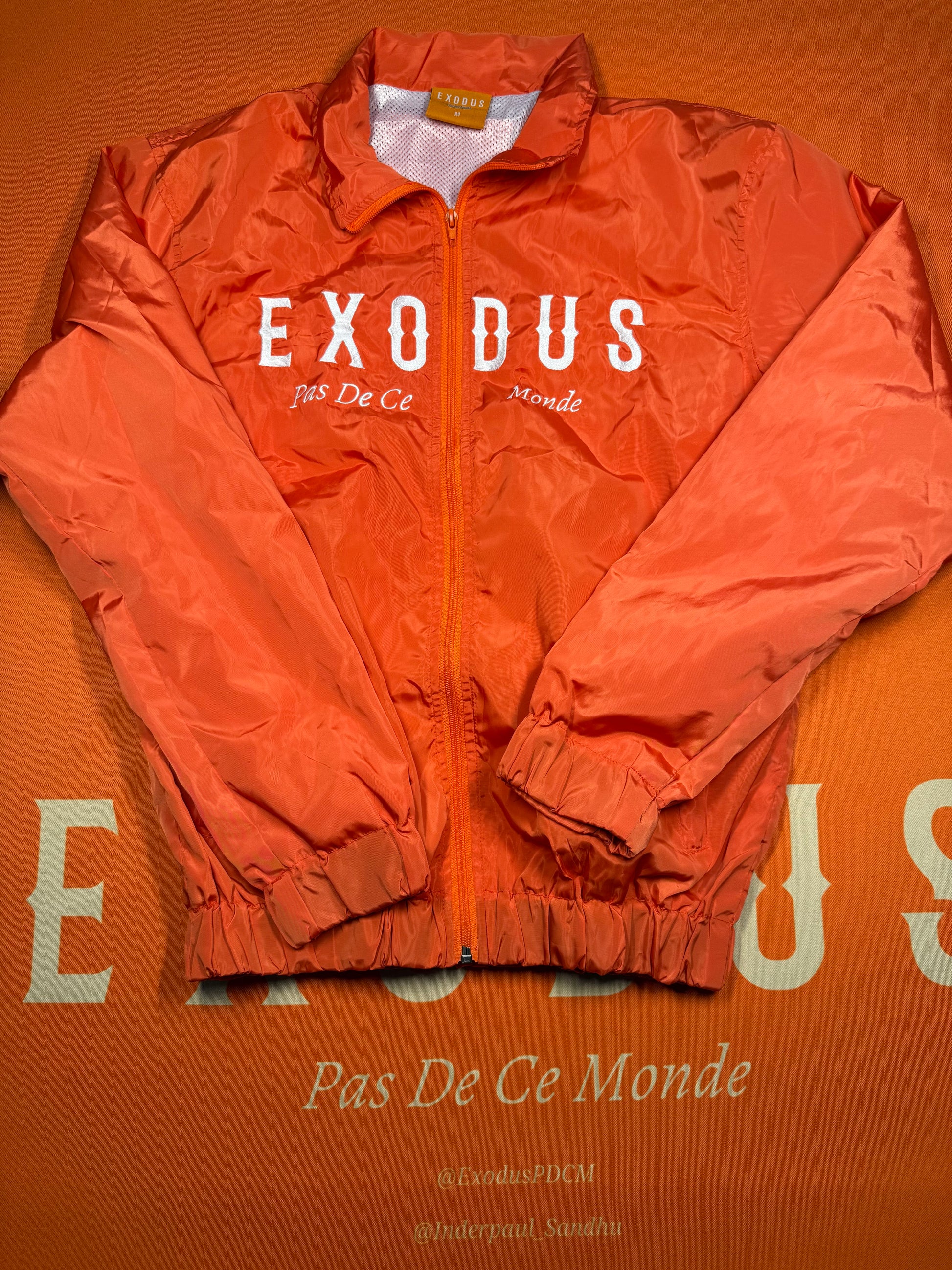 Clothing and accessories from Exodus Pas De Ce Monde – unisex streetwear including t-shirts, jackets, sunglasses, jewelry, bags, and headwear designed for everyday wear and bold urban fashion.