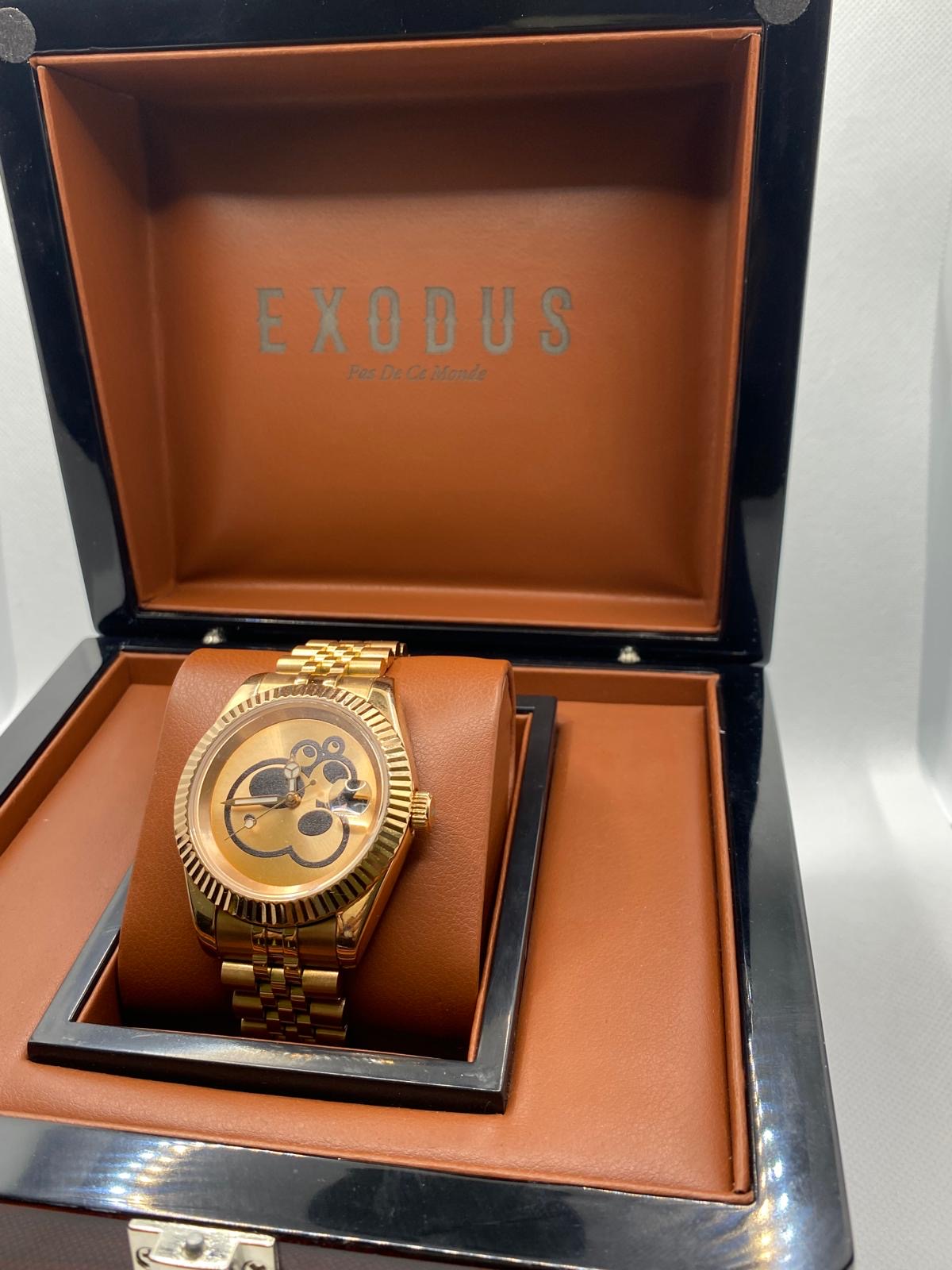 Clothing and accessories from Exodus Pas De Ce Monde – unisex streetwear including t-shirts, jackets, sunglasses, jewelry, bags, and headwear designed for everyday wear and bold urban fashion.