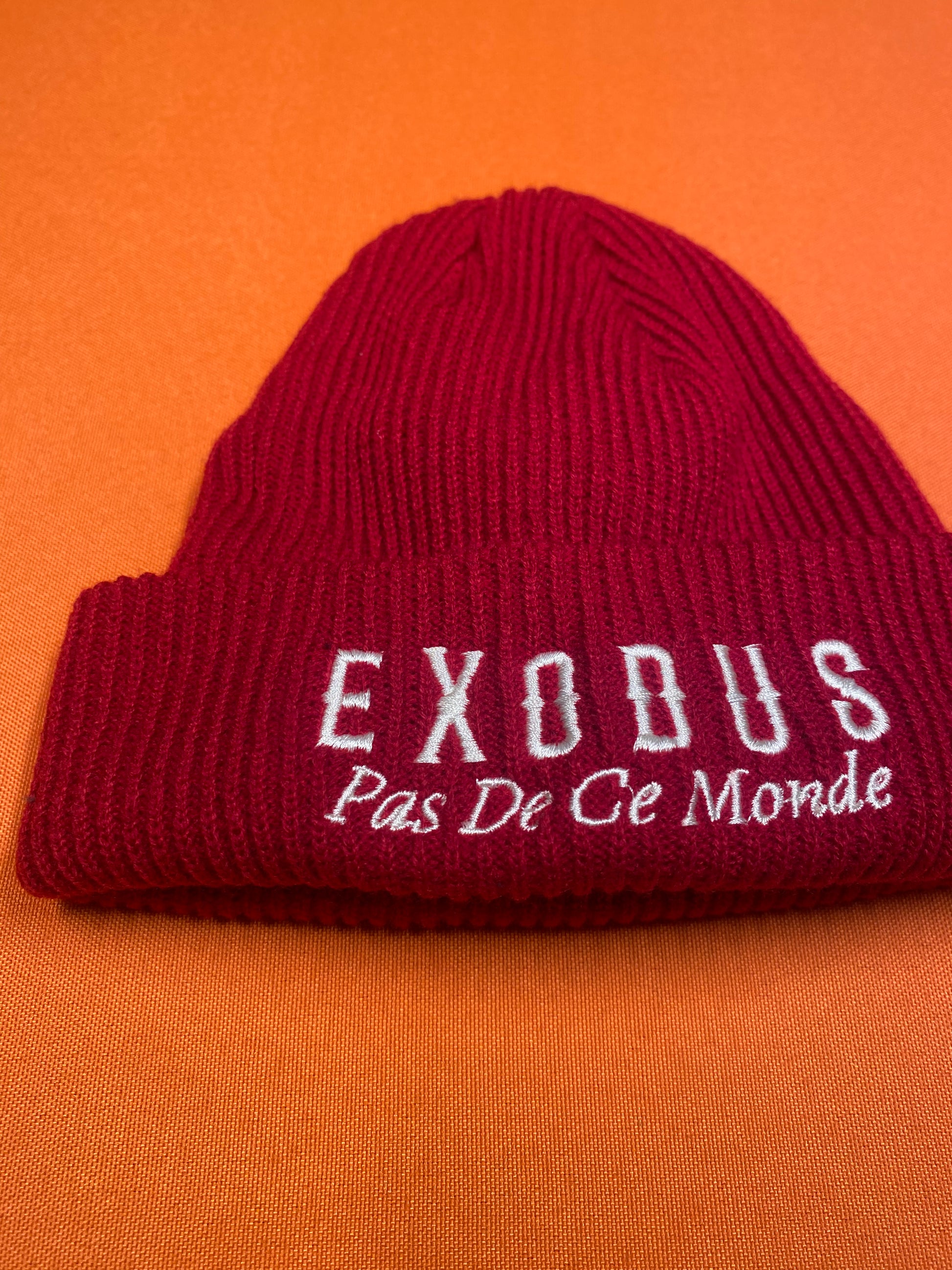 Clothing and accessories from Exodus Pas De Ce Monde – unisex streetwear including t-shirts, jackets, sunglasses, jewelry, bags, and headwear designed for everyday wear and bold urban fashion.