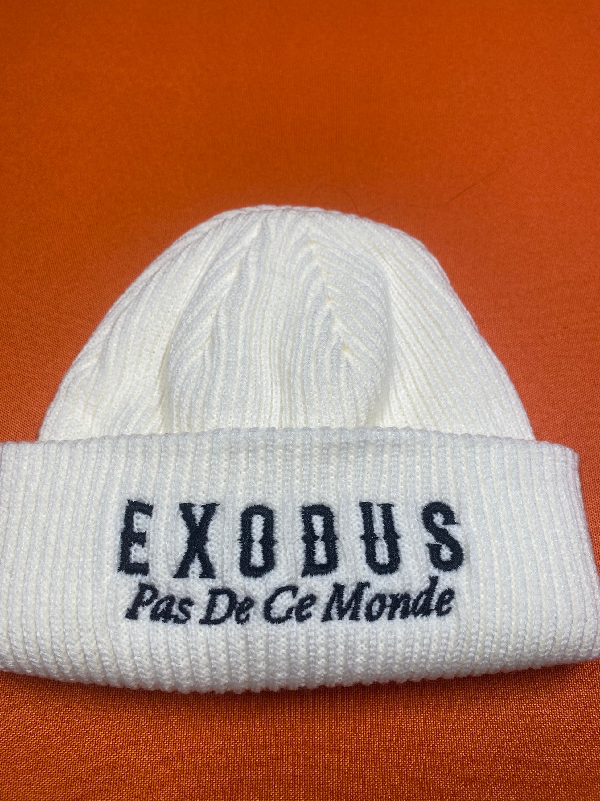 Clothing and accessories from Exodus Pas De Ce Monde – unisex streetwear including t-shirts, jackets, sunglasses, jewelry, bags, and headwear designed for everyday wear and bold urban fashion.