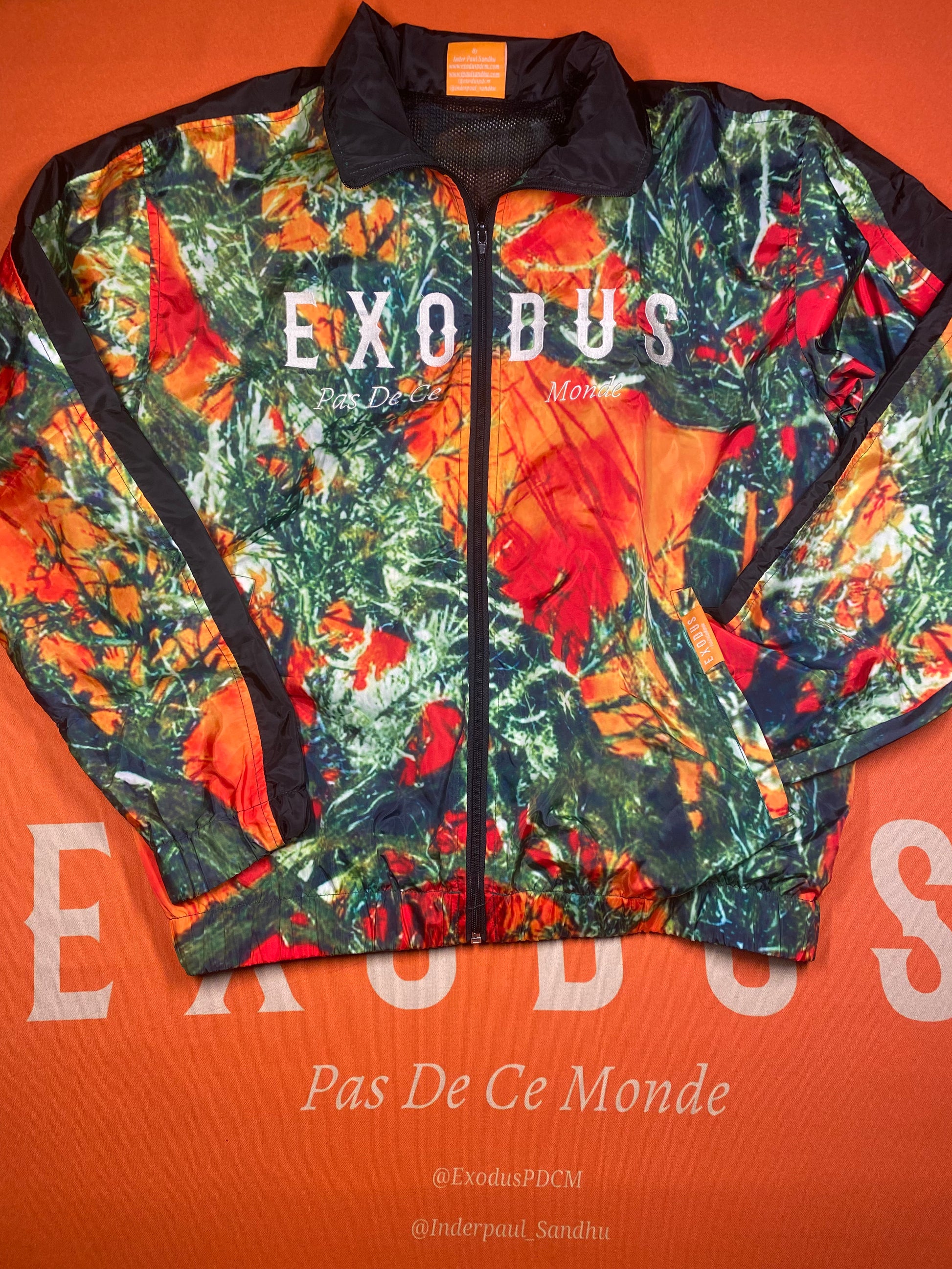 Clothing and accessories from Exodus Pas De Ce Monde – unisex streetwear including t-shirts, jackets, sunglasses, jewelry, bags, and headwear designed for everyday wear and bold urban fashion.