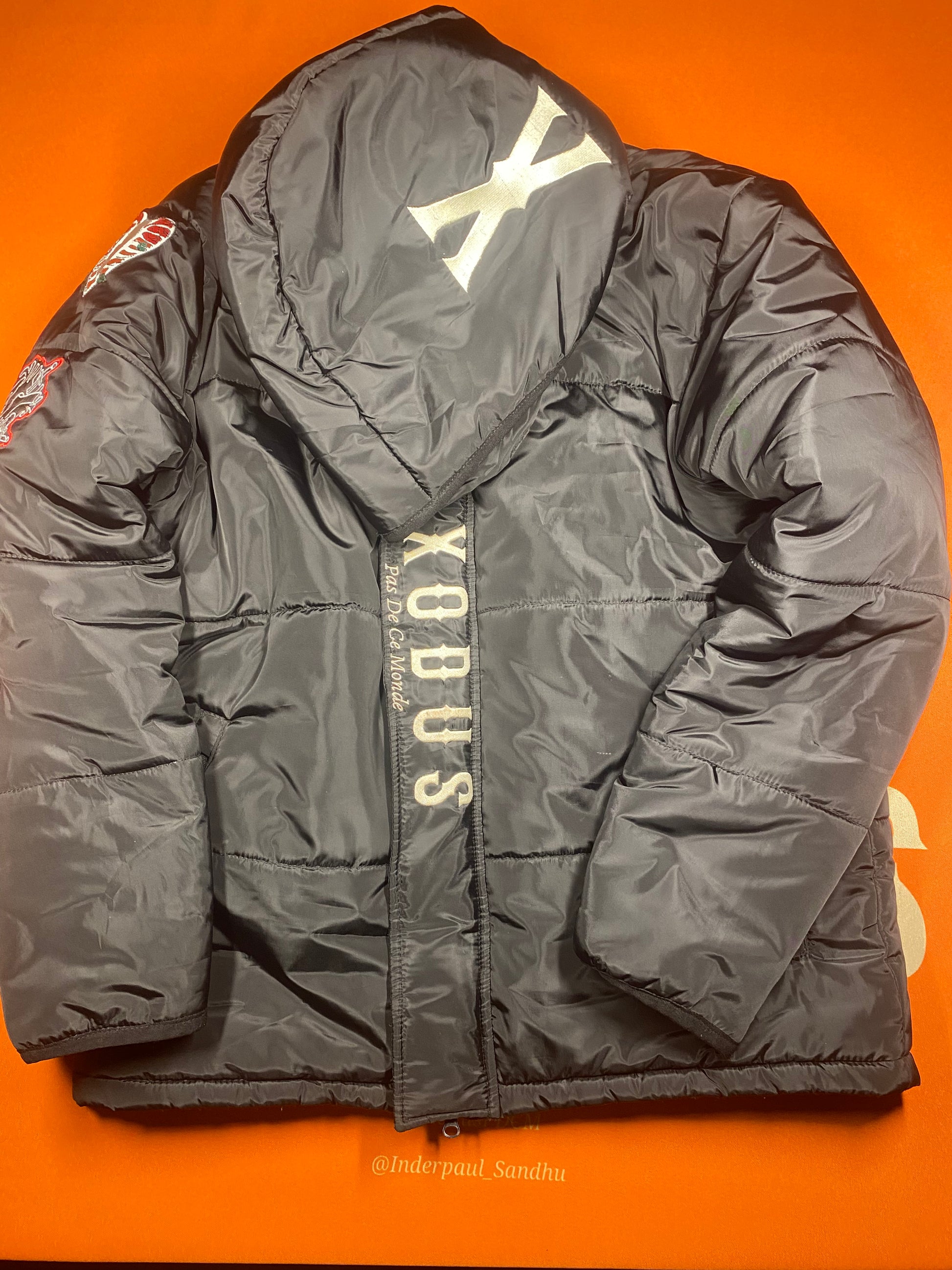 Clothing and accessories from Exodus Pas De Ce Monde – unisex streetwear including t-shirts, jackets, sunglasses, jewelry, bags, and headwear designed for everyday wear and bold urban fashion.