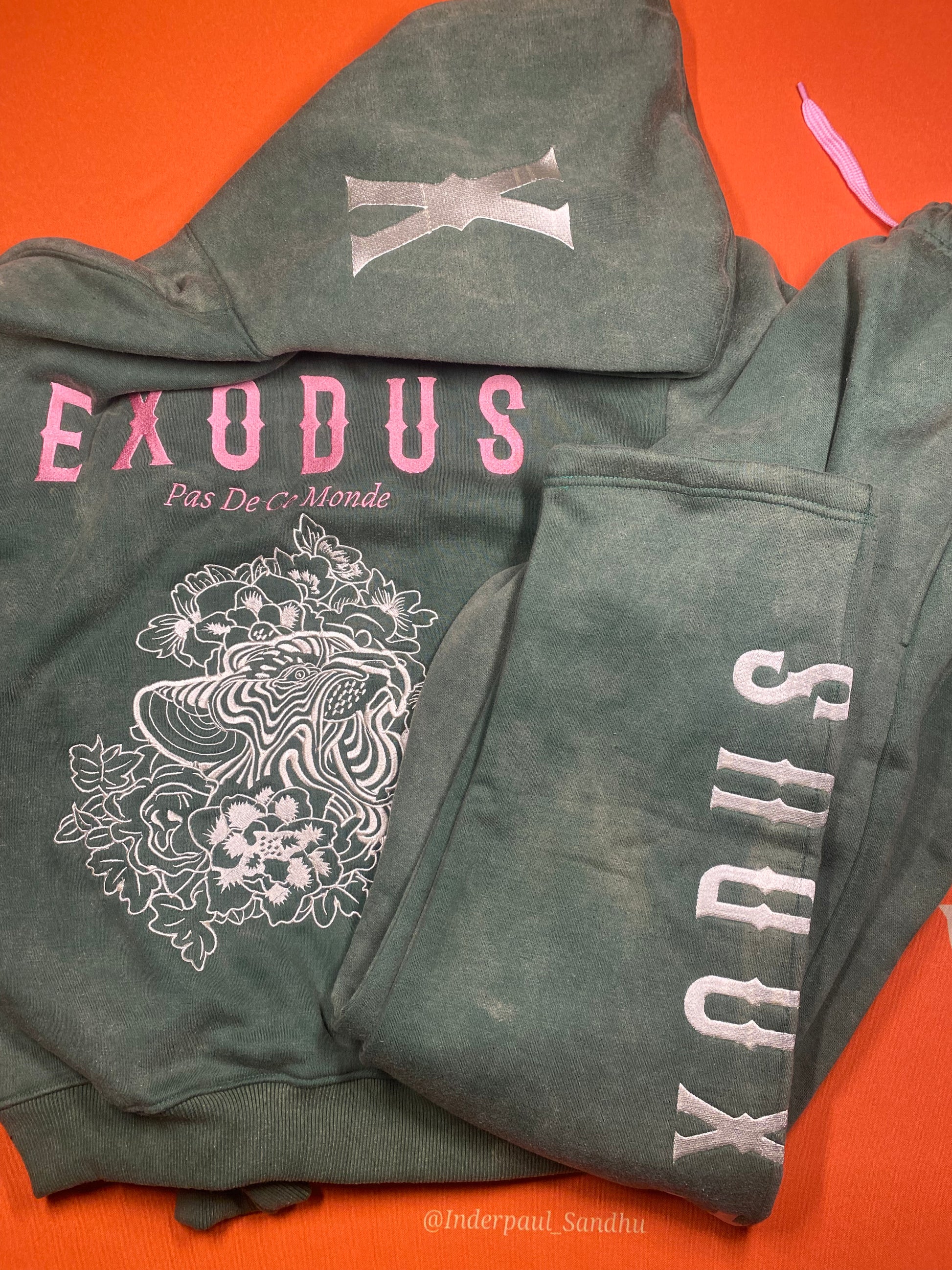 Clothing and accessories from Exodus Pas De Ce Monde – unisex streetwear including t-shirts, jackets, sunglasses, jewelry, bags, and headwear designed for everyday wear and bold urban fashion.