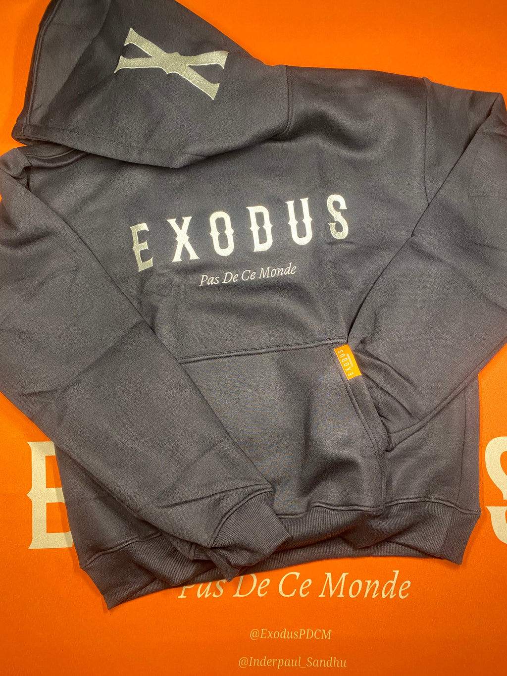 Clothing and accessories from Exodus Pas De Ce Monde – unisex streetwear including t-shirts, jackets, sunglasses, jewelry, bags, and headwear designed for everyday wear and bold urban fashion.
