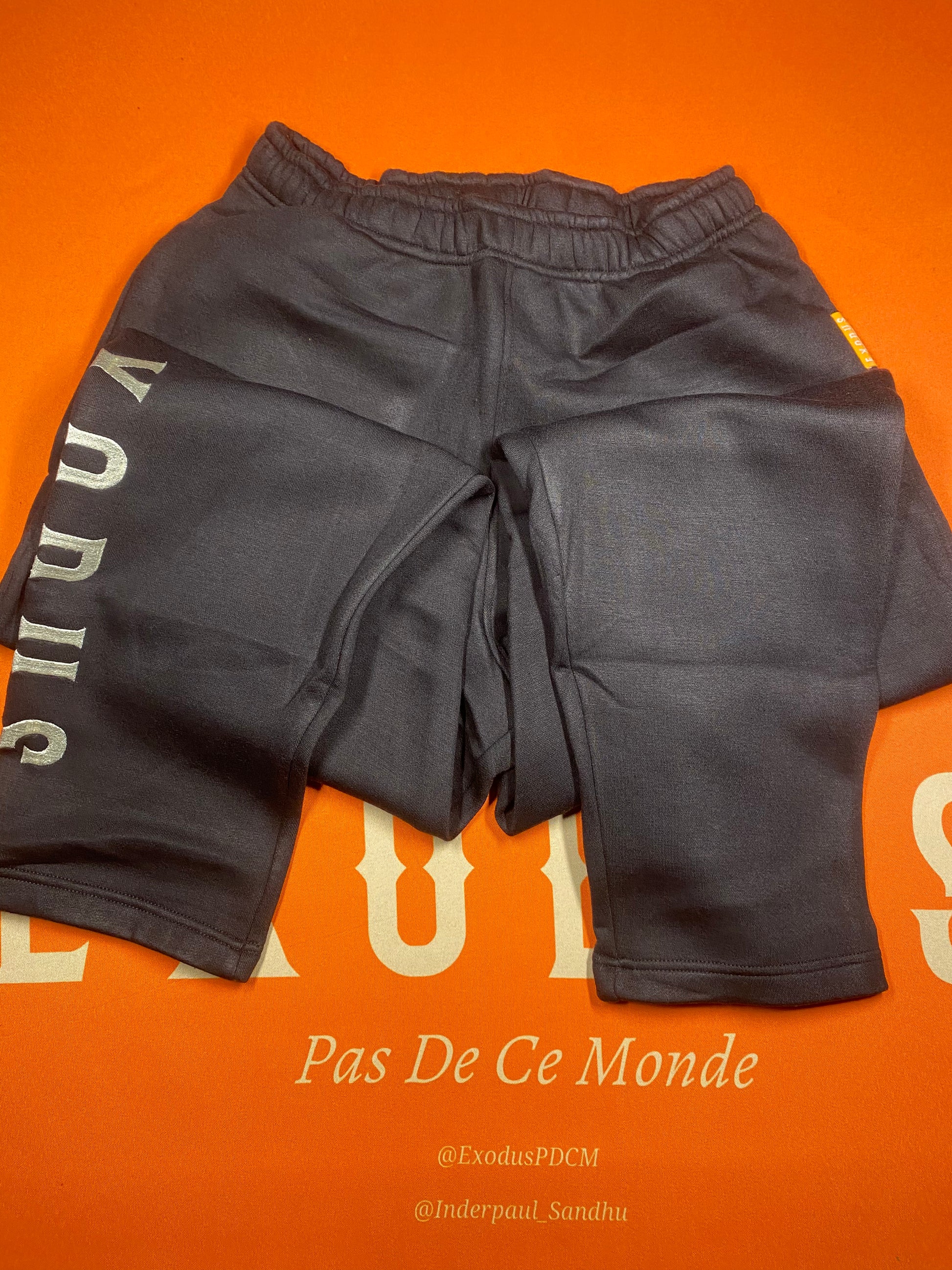 Clothing and accessories from Exodus Pas De Ce Monde – unisex streetwear including t-shirts, jackets, sunglasses, jewelry, bags, and headwear designed for everyday wear and bold urban fashion.
