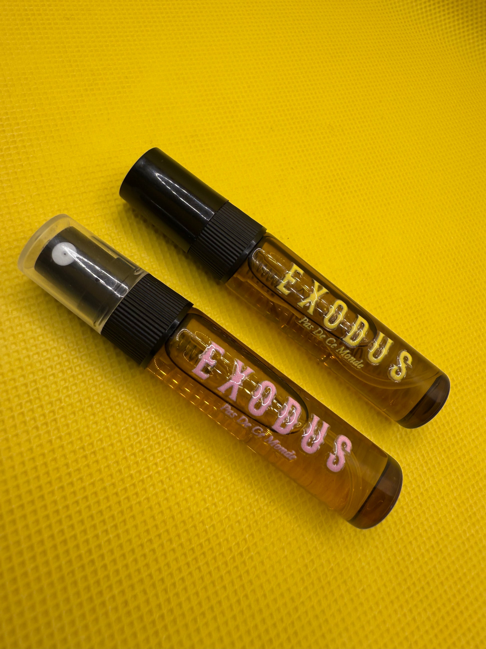 Clothing and accessories from Exodus Pas De Ce Monde – unisex streetwear including t-shirts, jackets, sunglasses, jewelry, bags, and headwear designed for everyday wear and bold urban fashion.