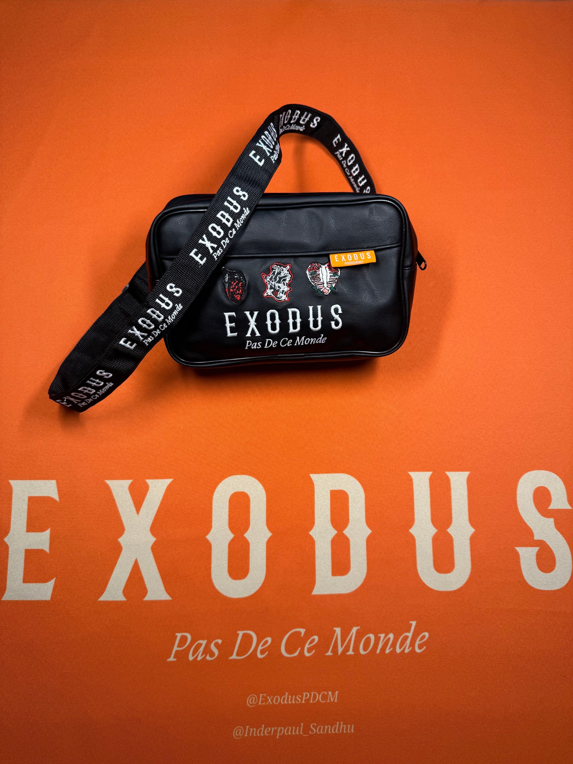 Clothing and accessories from Exodus Pas De Ce Monde – unisex streetwear including t-shirts, jackets, sunglasses, jewelry, bags, and headwear designed for everyday wear and bold urban fashion.
