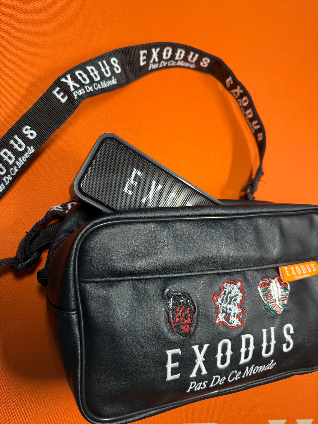 Clothing and accessories from Exodus Pas De Ce Monde – unisex streetwear including t-shirts, jackets, sunglasses, jewelry, bags, and headwear designed for everyday wear and bold urban fashion.
