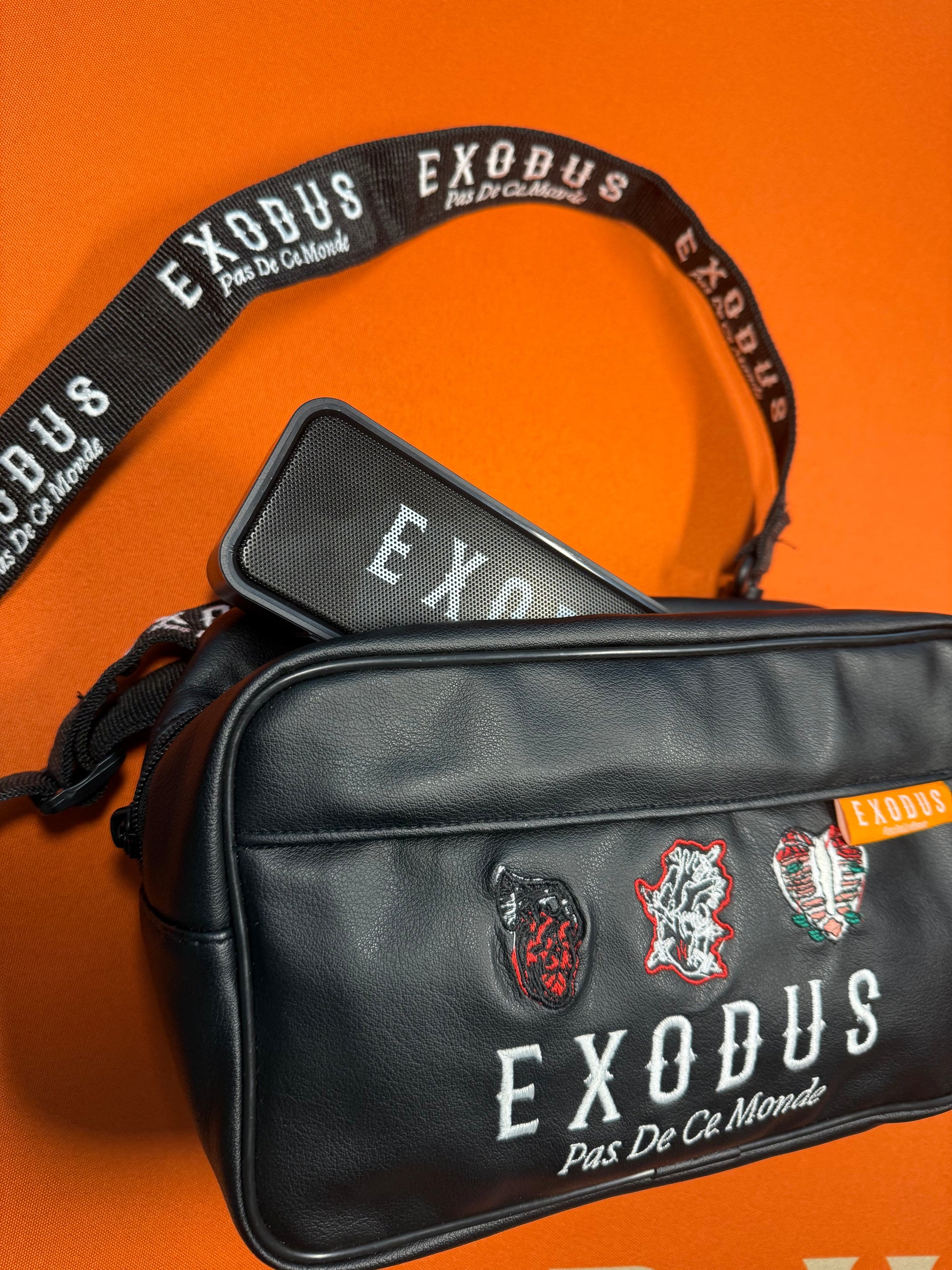 Clothing and accessories from Exodus Pas De Ce Monde – unisex streetwear including t-shirts, jackets, sunglasses, jewelry, bags, and headwear designed for everyday wear and bold urban fashion.
