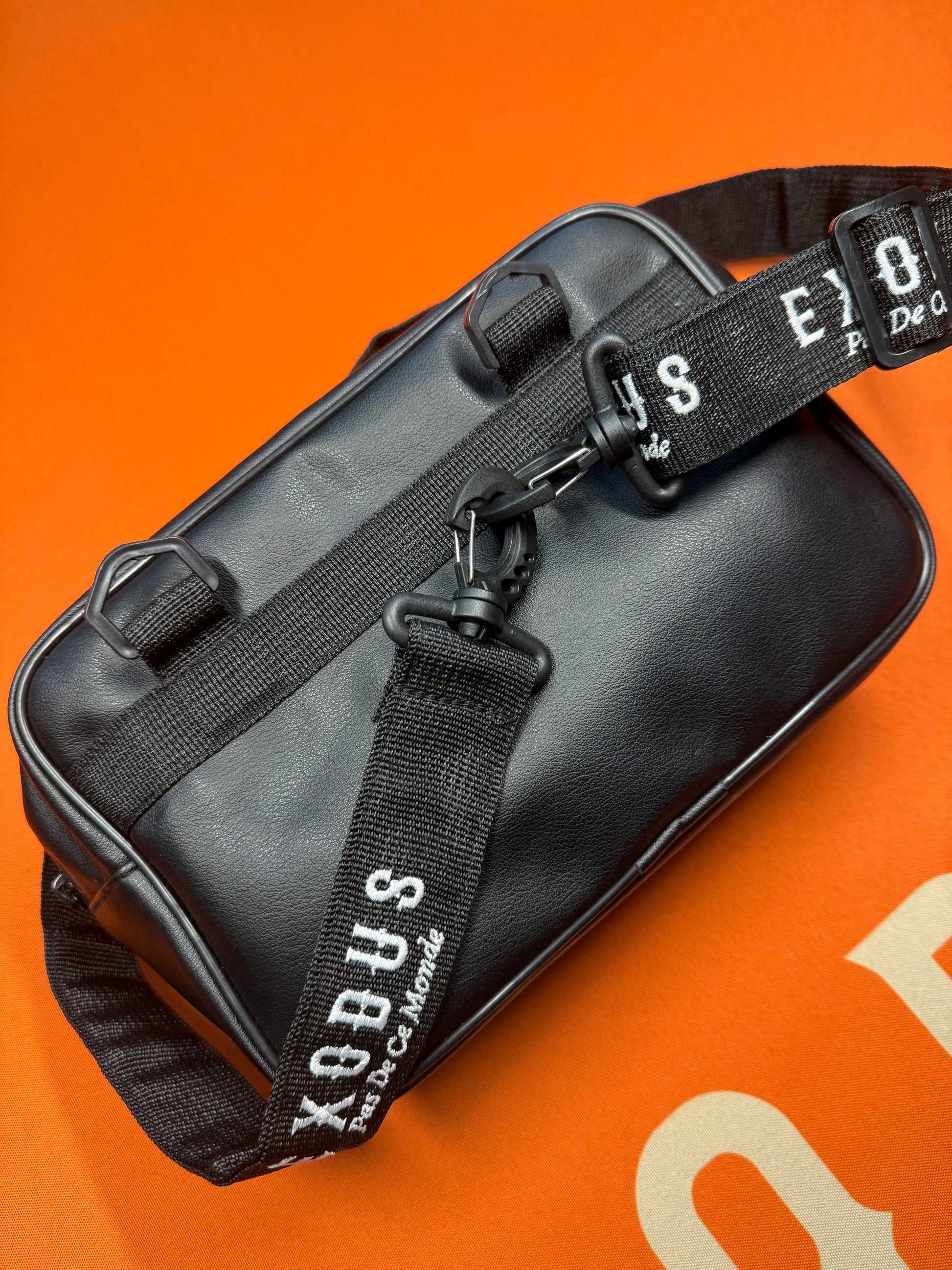 Clothing and accessories from Exodus Pas De Ce Monde – unisex streetwear including t-shirts, jackets, sunglasses, jewelry, bags, and headwear designed for everyday wear and bold urban fashion.
