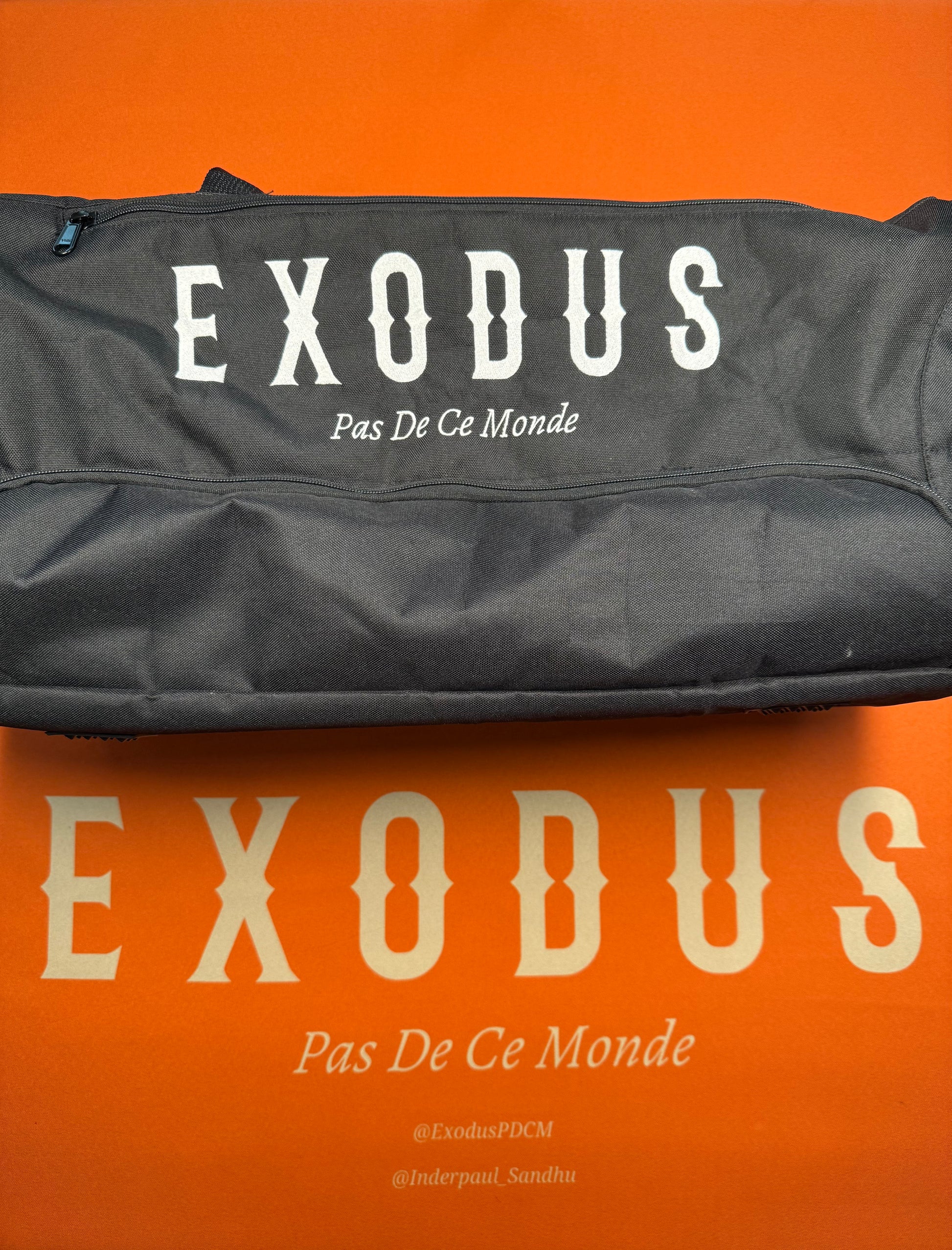 Clothing and accessories from Exodus Pas De Ce Monde – unisex streetwear including t-shirts, jackets, sunglasses, jewelry, bags, and headwear designed for everyday wear and bold urban fashion.
