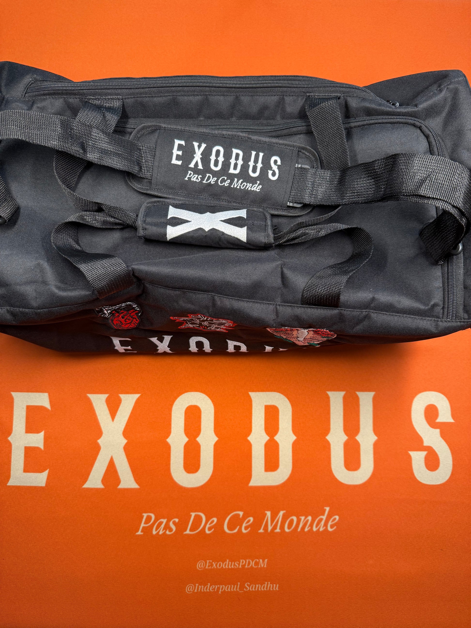 Clothing and accessories from Exodus Pas De Ce Monde – unisex streetwear including t-shirts, jackets, sunglasses, jewelry, bags, and headwear designed for everyday wear and bold urban fashion.
