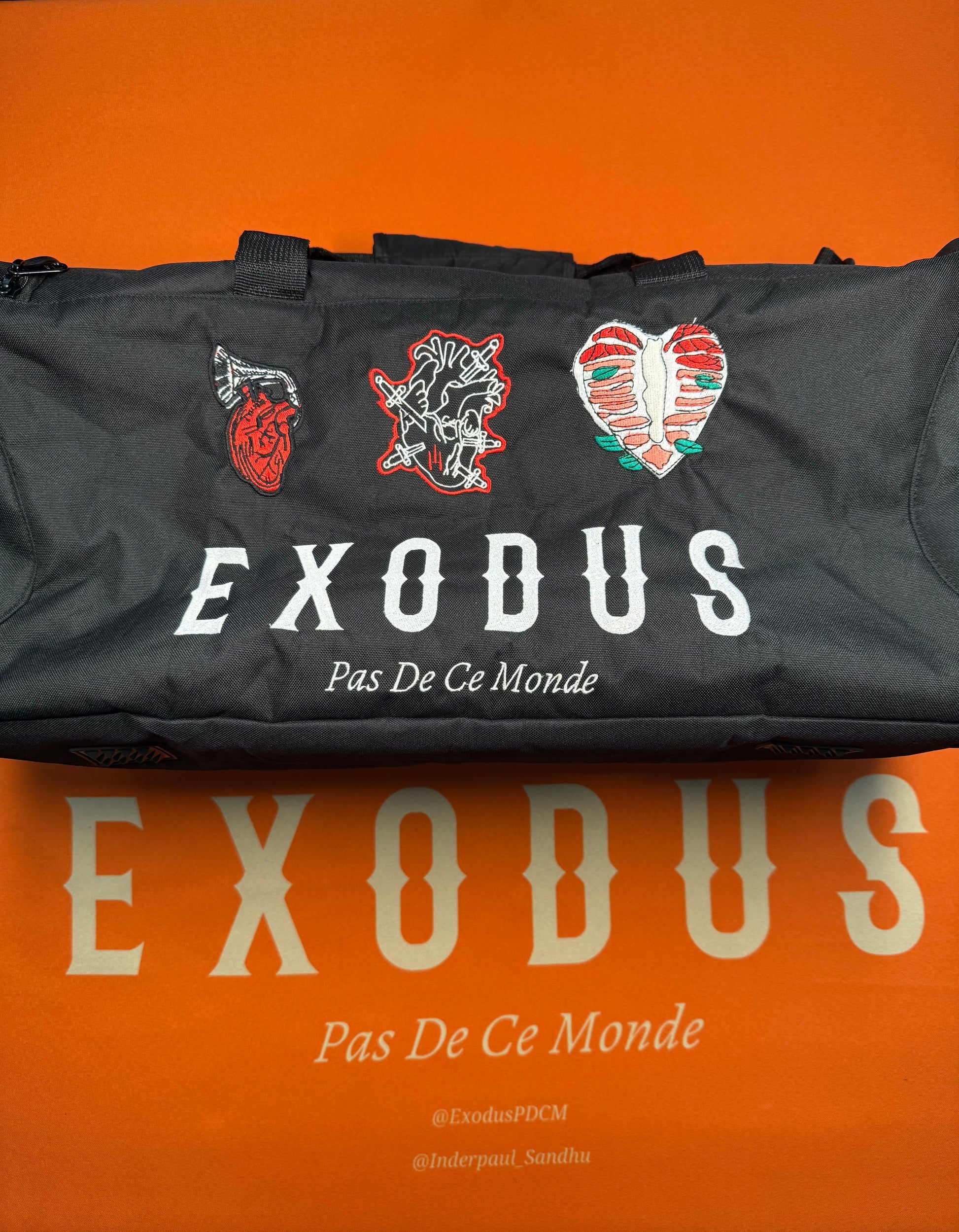 Clothing and accessories from Exodus Pas De Ce Monde – unisex streetwear including t-shirts, jackets, sunglasses, jewelry, bags, and headwear designed for everyday wear and bold urban fashion.
