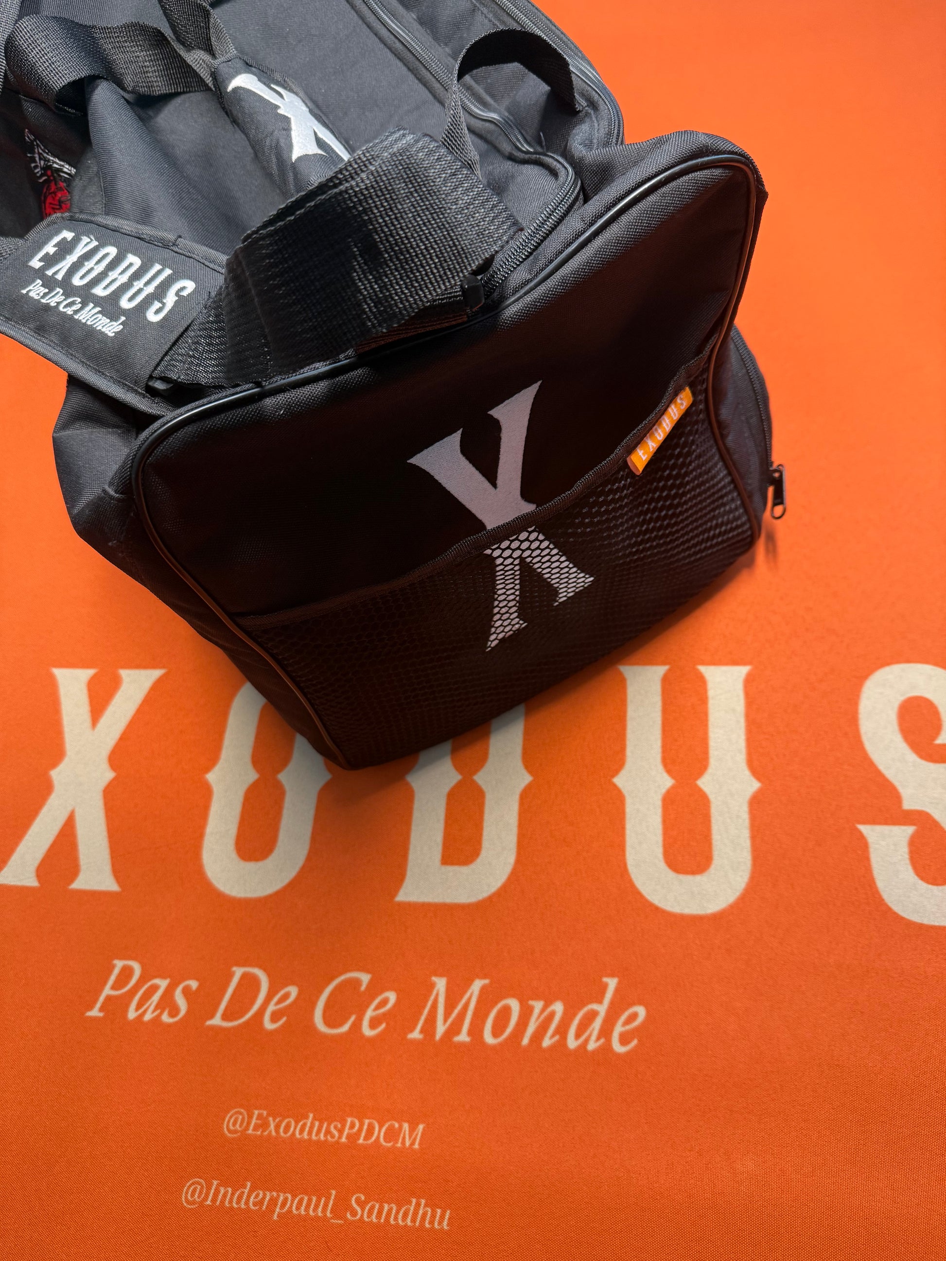 Clothing and accessories from Exodus Pas De Ce Monde – unisex streetwear including t-shirts, jackets, sunglasses, jewelry, bags, and headwear designed for everyday wear and bold urban fashion.
