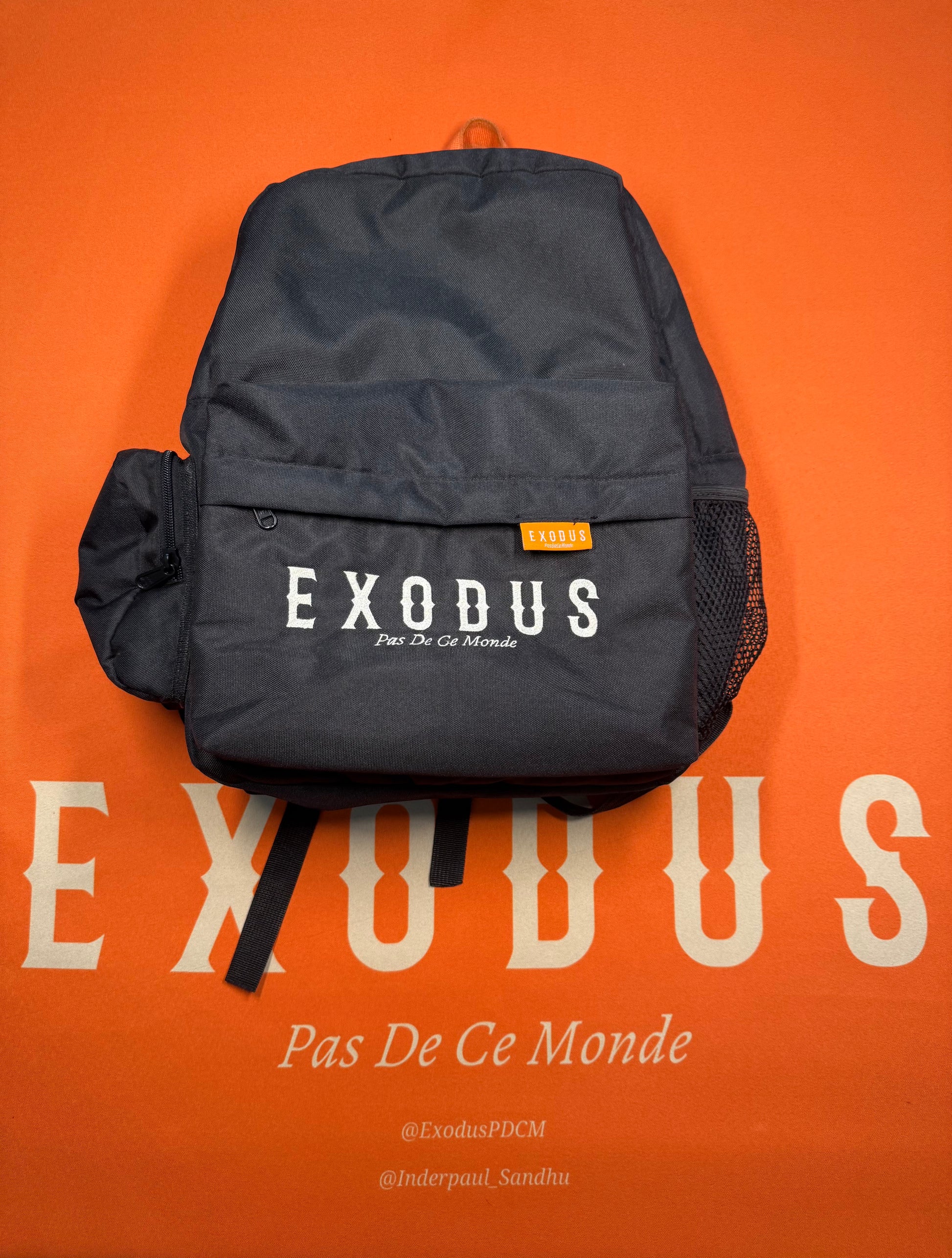 Clothing and accessories from Exodus Pas De Ce Monde – unisex streetwear including t-shirts, jackets, sunglasses, jewelry, bags, and headwear designed for everyday wear and bold urban fashion.