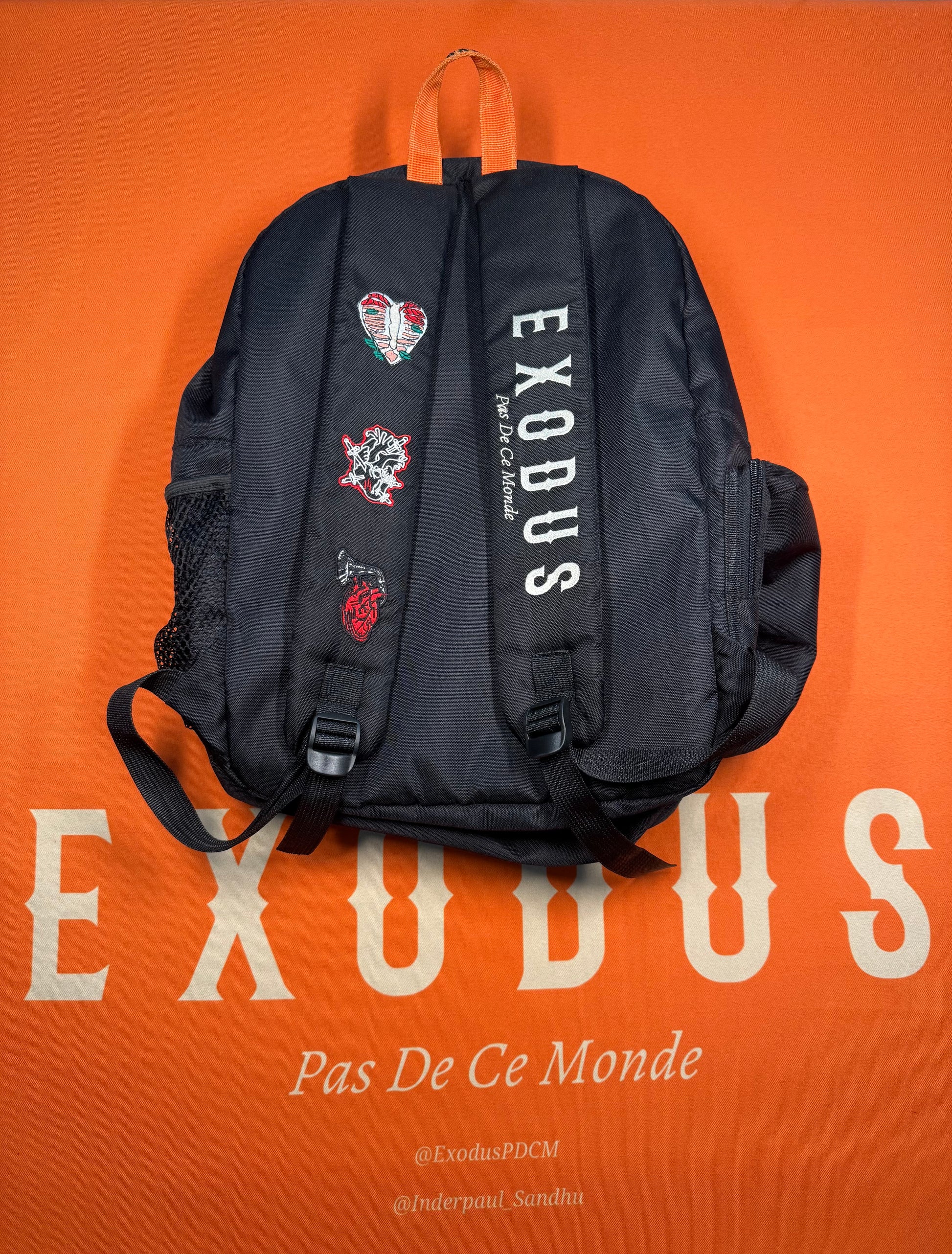 Clothing and accessories from Exodus Pas De Ce Monde – unisex streetwear including t-shirts, jackets, sunglasses, jewelry, bags, and headwear designed for everyday wear and bold urban fashion.