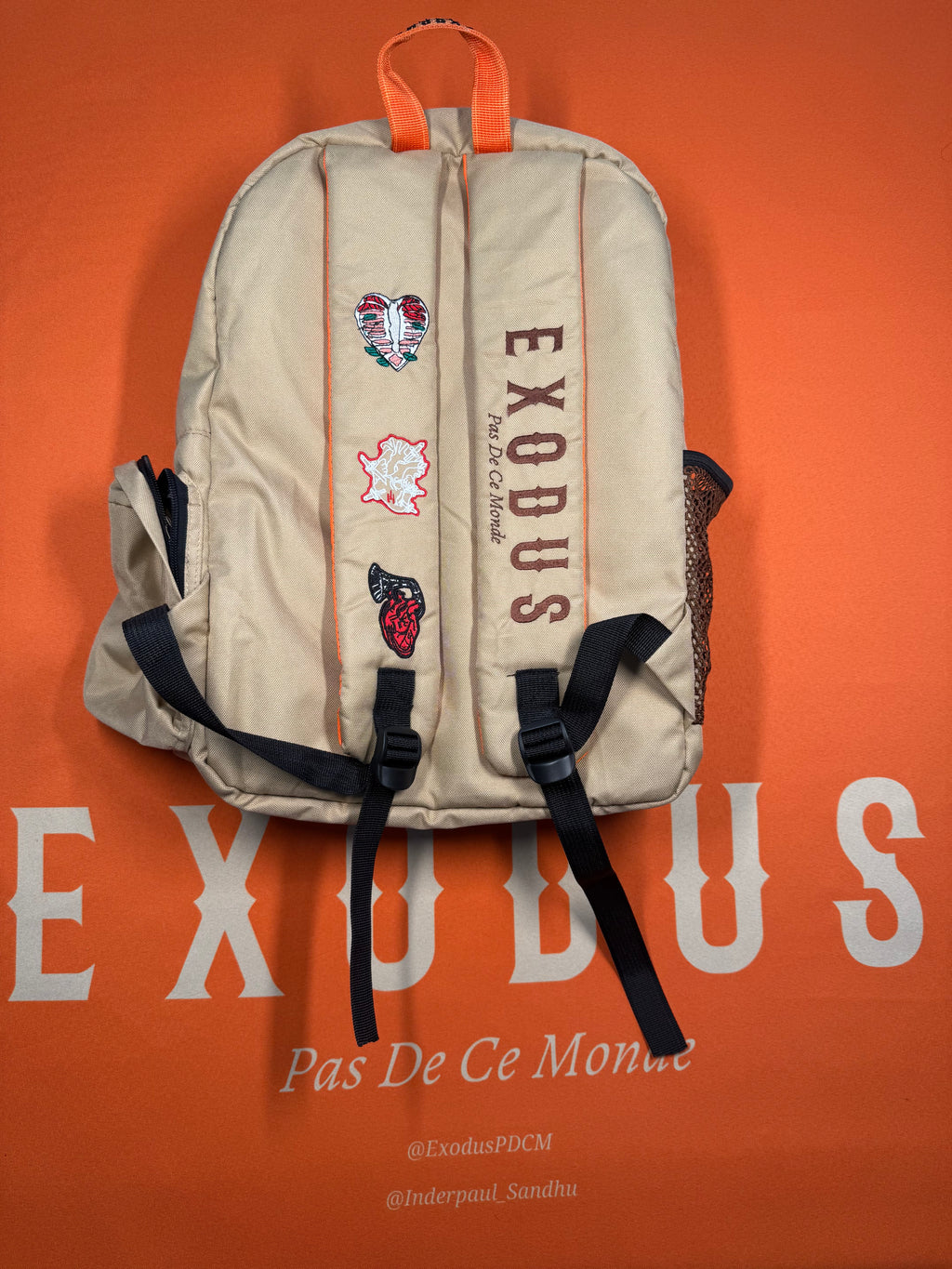 Clothing and accessories from Exodus Pas De Ce Monde – unisex streetwear including t-shirts, jackets, sunglasses, jewelry, bags, and headwear designed for everyday wear and bold urban fashion.