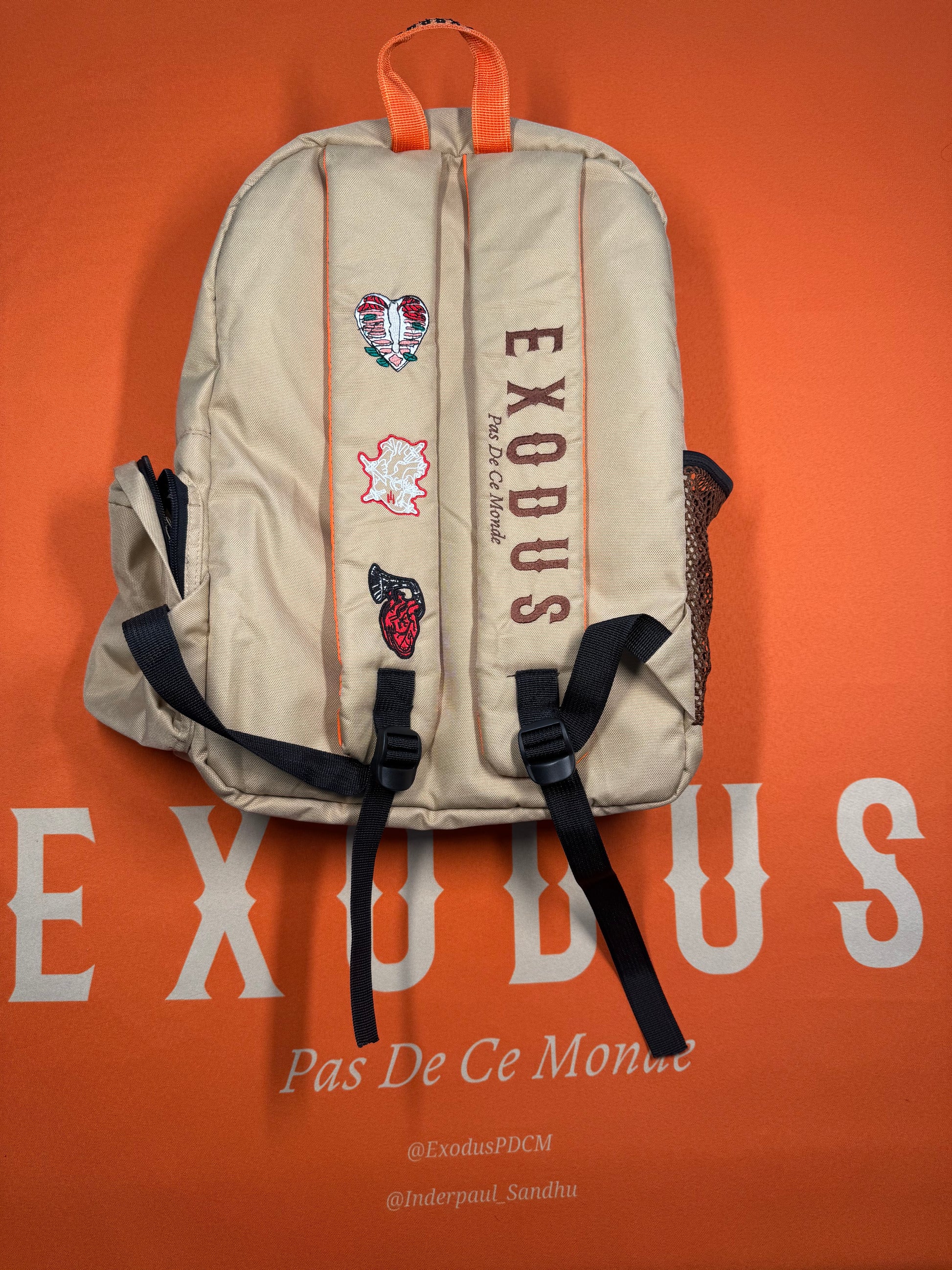 Clothing and accessories from Exodus Pas De Ce Monde – unisex streetwear including t-shirts, jackets, sunglasses, jewelry, bags, and headwear designed for everyday wear and bold urban fashion.