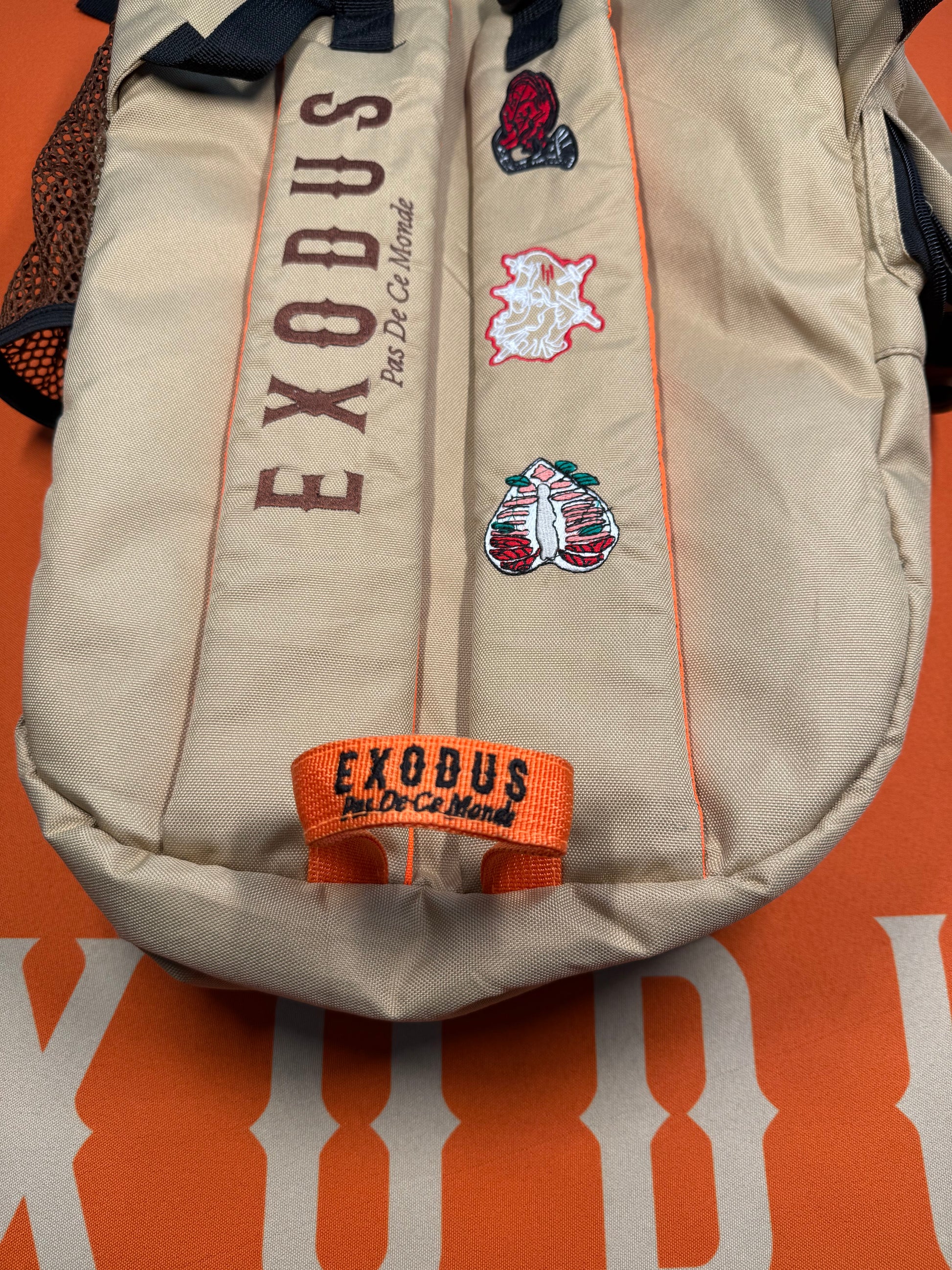 Clothing and accessories from Exodus Pas De Ce Monde – unisex streetwear including t-shirts, jackets, sunglasses, jewelry, bags, and headwear designed for everyday wear and bold urban fashion.