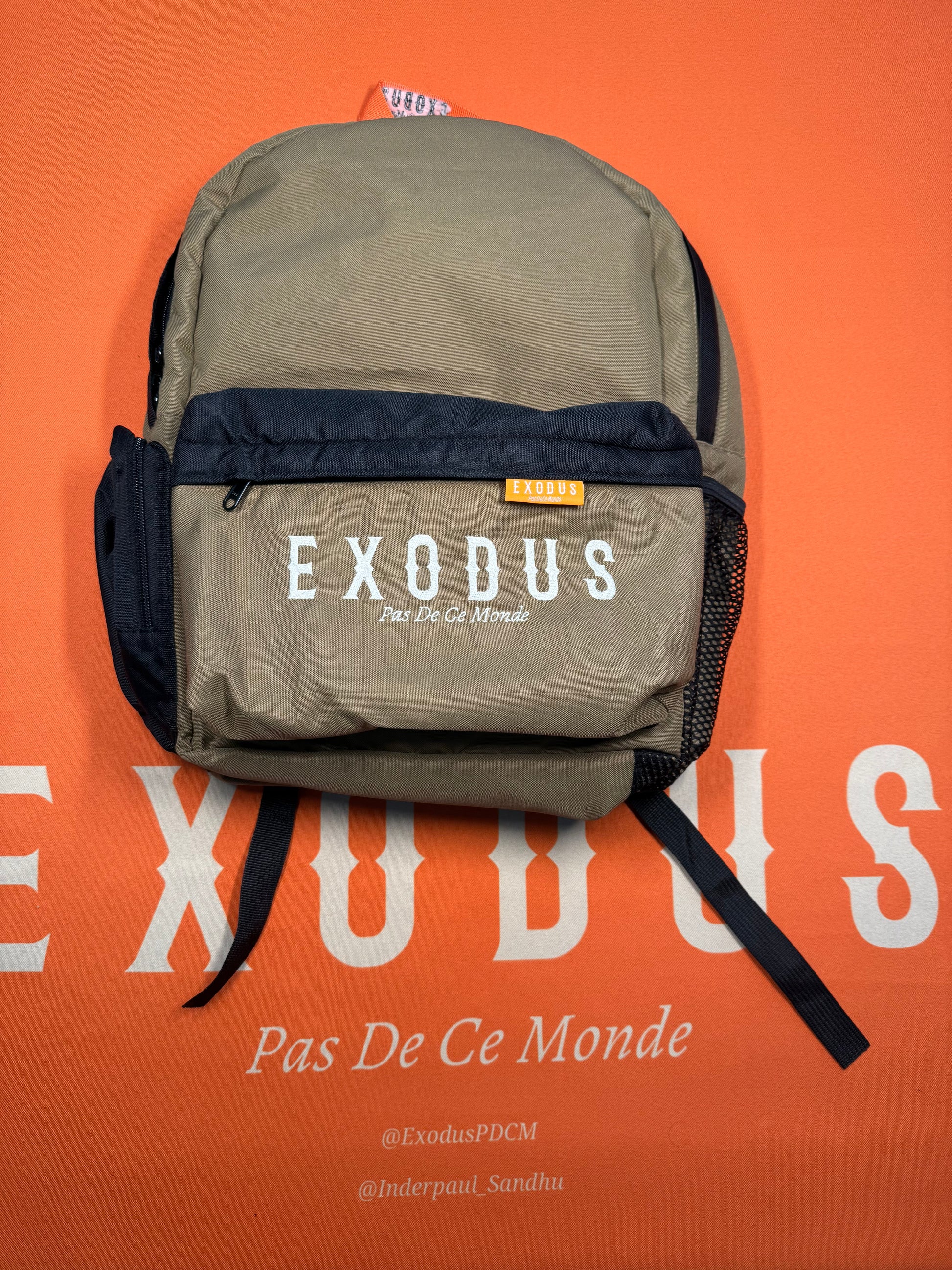 Clothing and accessories from Exodus Pas De Ce Monde – unisex streetwear including t-shirts, jackets, sunglasses, jewelry, bags, and headwear designed for everyday wear and bold urban fashion.
