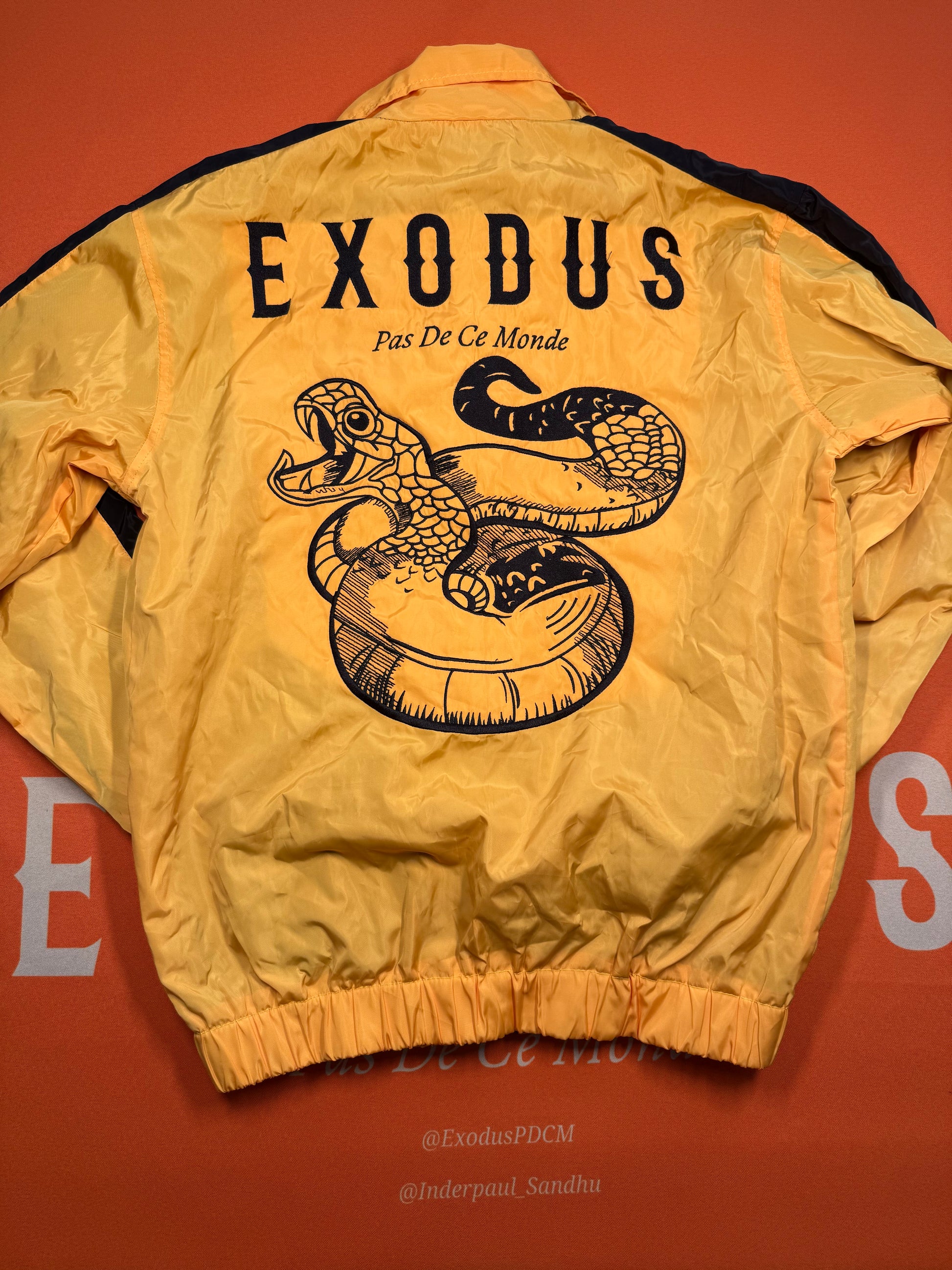 Clothing and accessories from Exodus Pas De Ce Monde – unisex streetwear including t-shirts, jackets, sunglasses, jewelry, bags, and headwear designed for everyday wear and bold urban fashion.