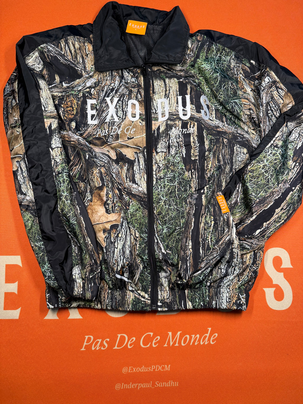 Clothing and accessories from Exodus Pas De Ce Monde – unisex streetwear including t-shirts, jackets, sunglasses, jewelry, bags, and headwear designed for everyday wear and bold urban fashion.