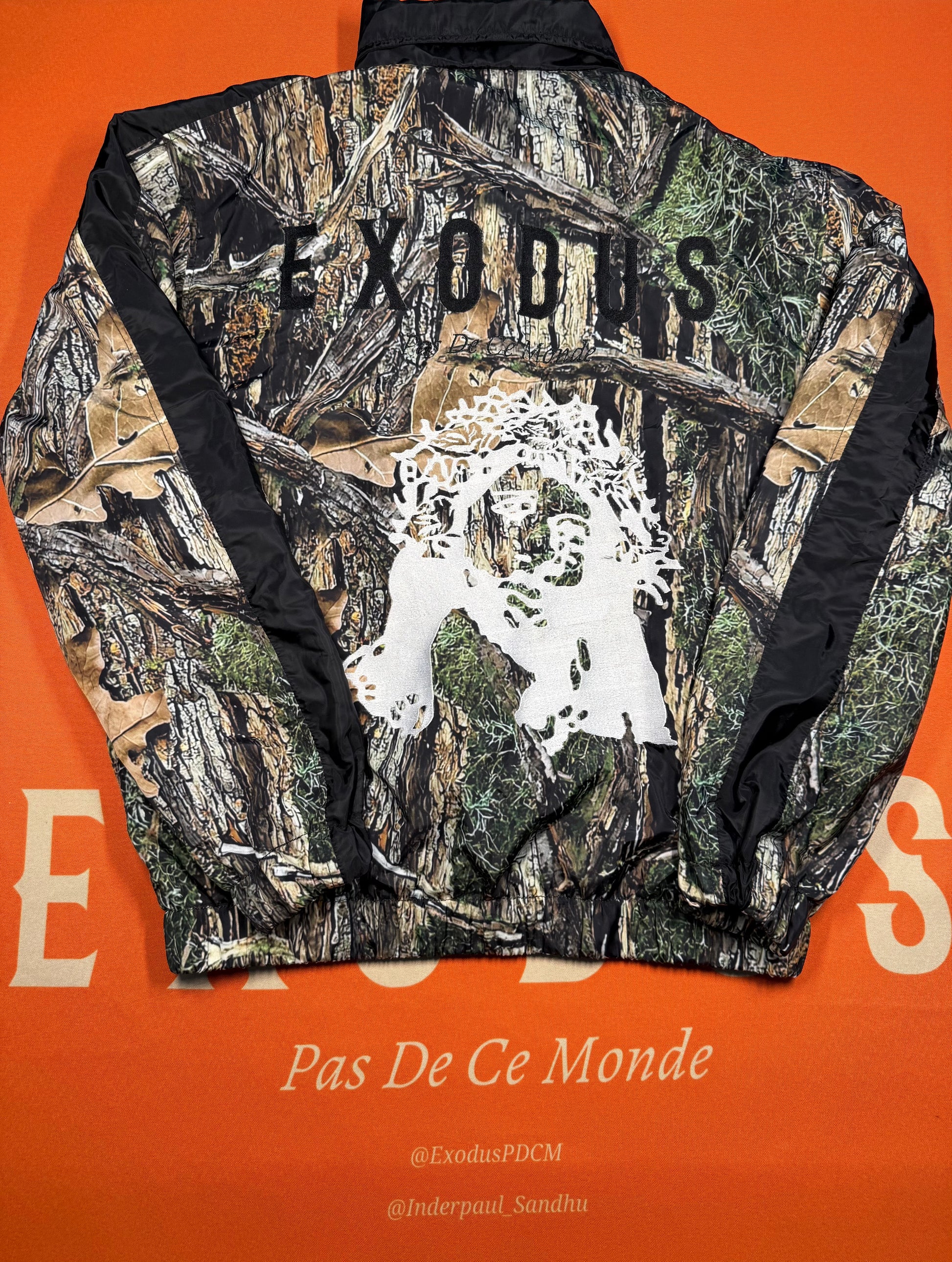Clothing and accessories from Exodus Pas De Ce Monde – unisex streetwear including t-shirts, jackets, sunglasses, jewelry, bags, and headwear designed for everyday wear and bold urban fashion.