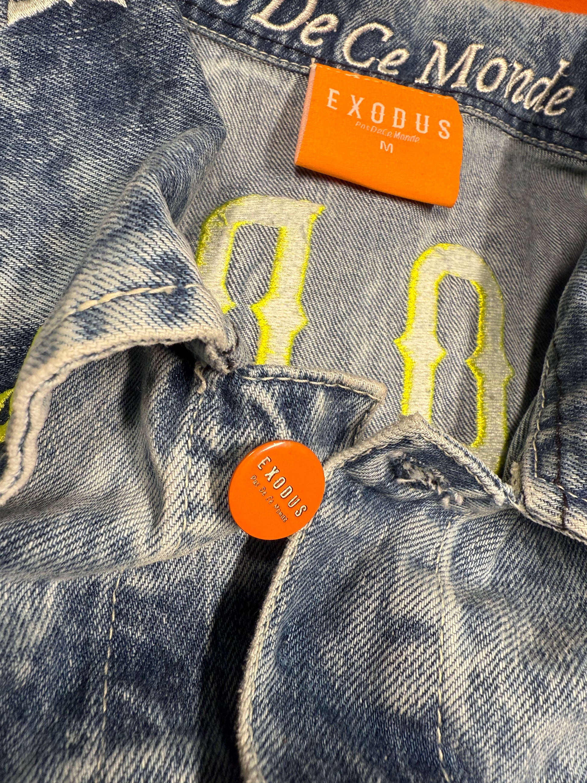 Clothing and accessories from Exodus Pas De Ce Monde – unisex streetwear including t-shirts, jackets, sunglasses, jewelry, bags, and headwear designed for everyday wear and bold urban fashion.