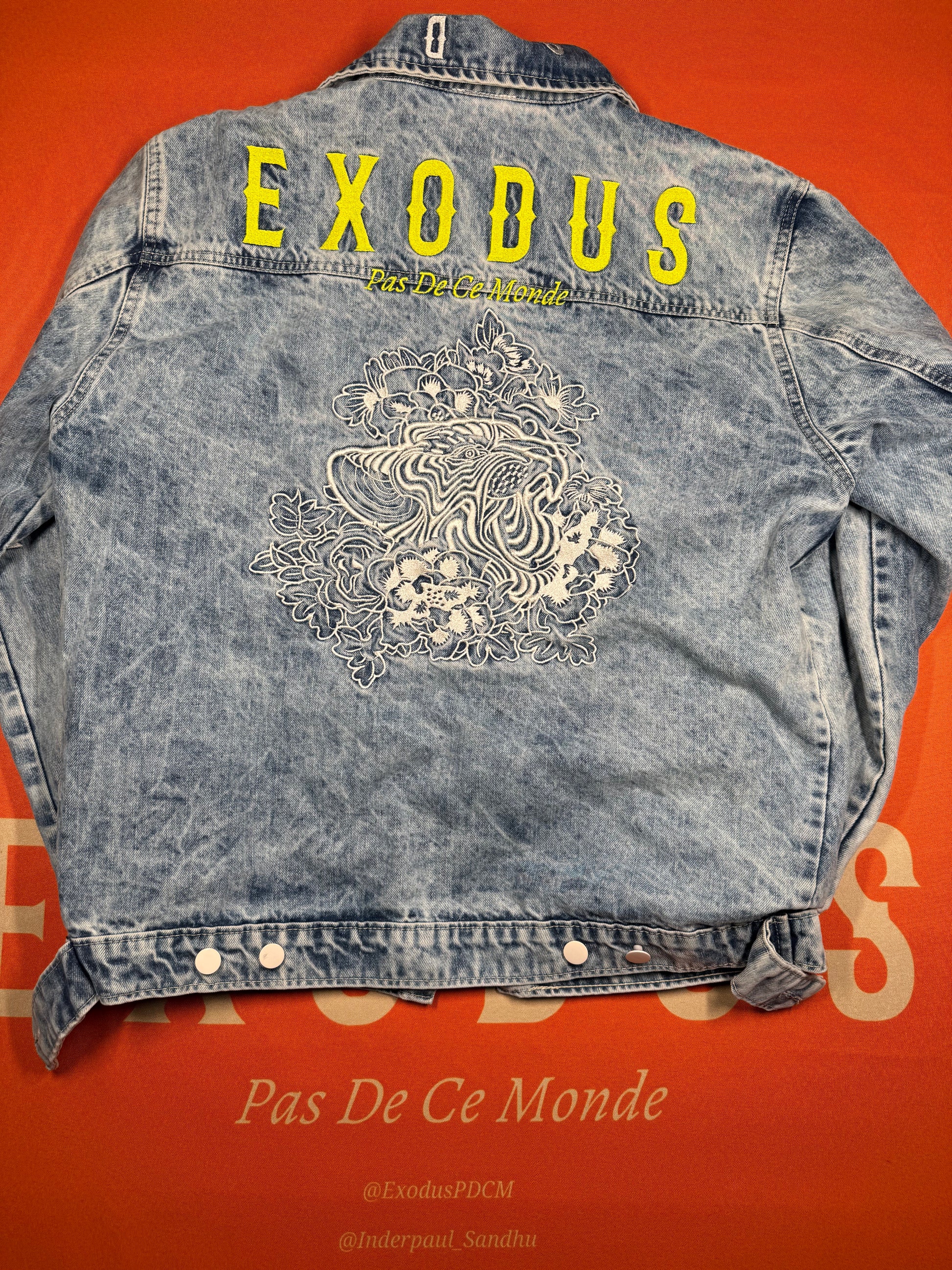 Clothing and accessories from Exodus Pas De Ce Monde – unisex streetwear including t-shirts, jackets, sunglasses, jewelry, bags, and headwear designed for everyday wear and bold urban fashion.