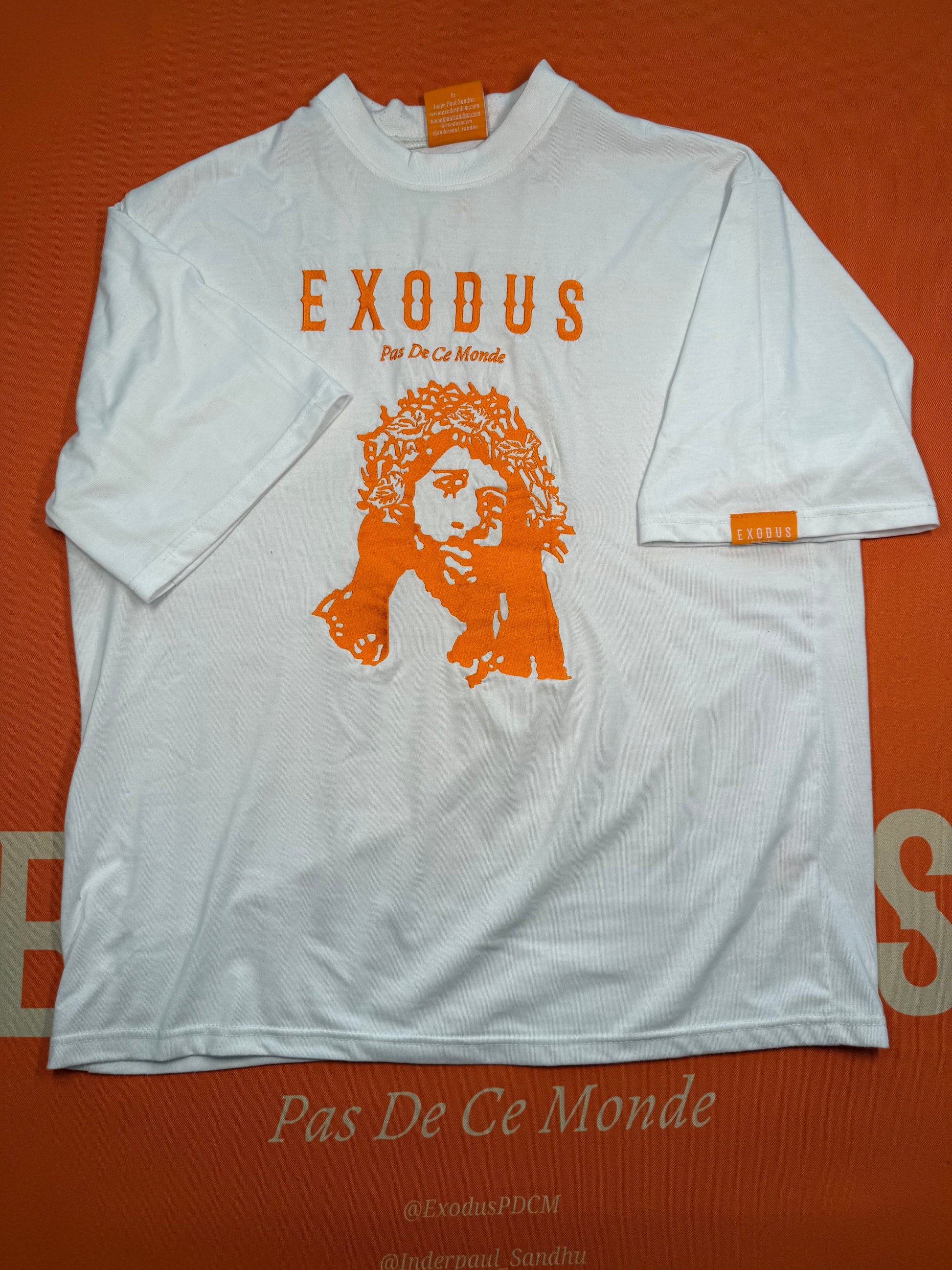 Clothing and accessories from Exodus Pas De Ce Monde – unisex streetwear including t-shirts, jackets, sunglasses, jewelry, bags, and headwear designed for everyday wear and bold urban fashion.