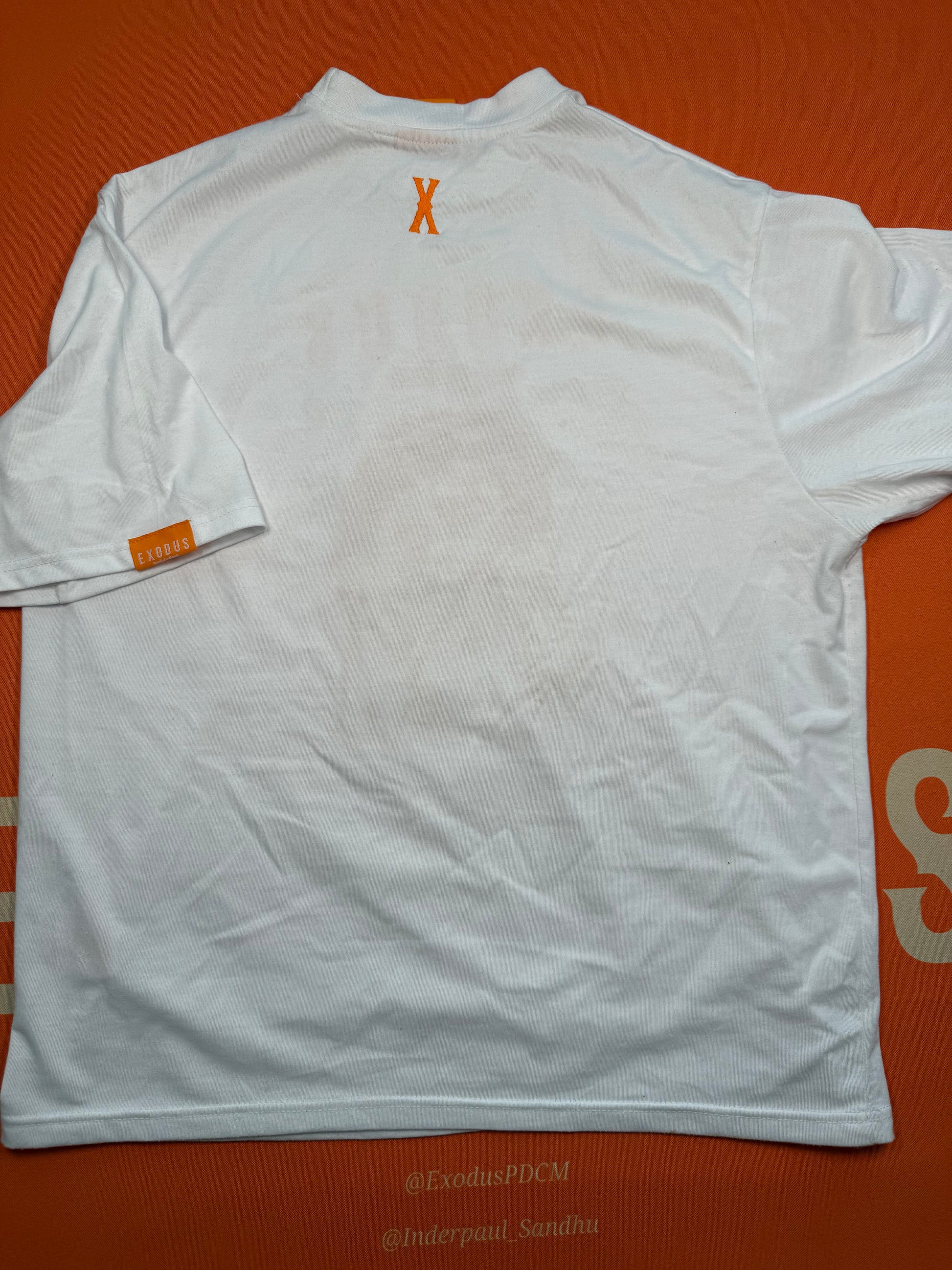 Clothing and accessories from Exodus Pas De Ce Monde – unisex streetwear including t-shirts, jackets, sunglasses, jewelry, bags, and headwear designed for everyday wear and bold urban fashion.