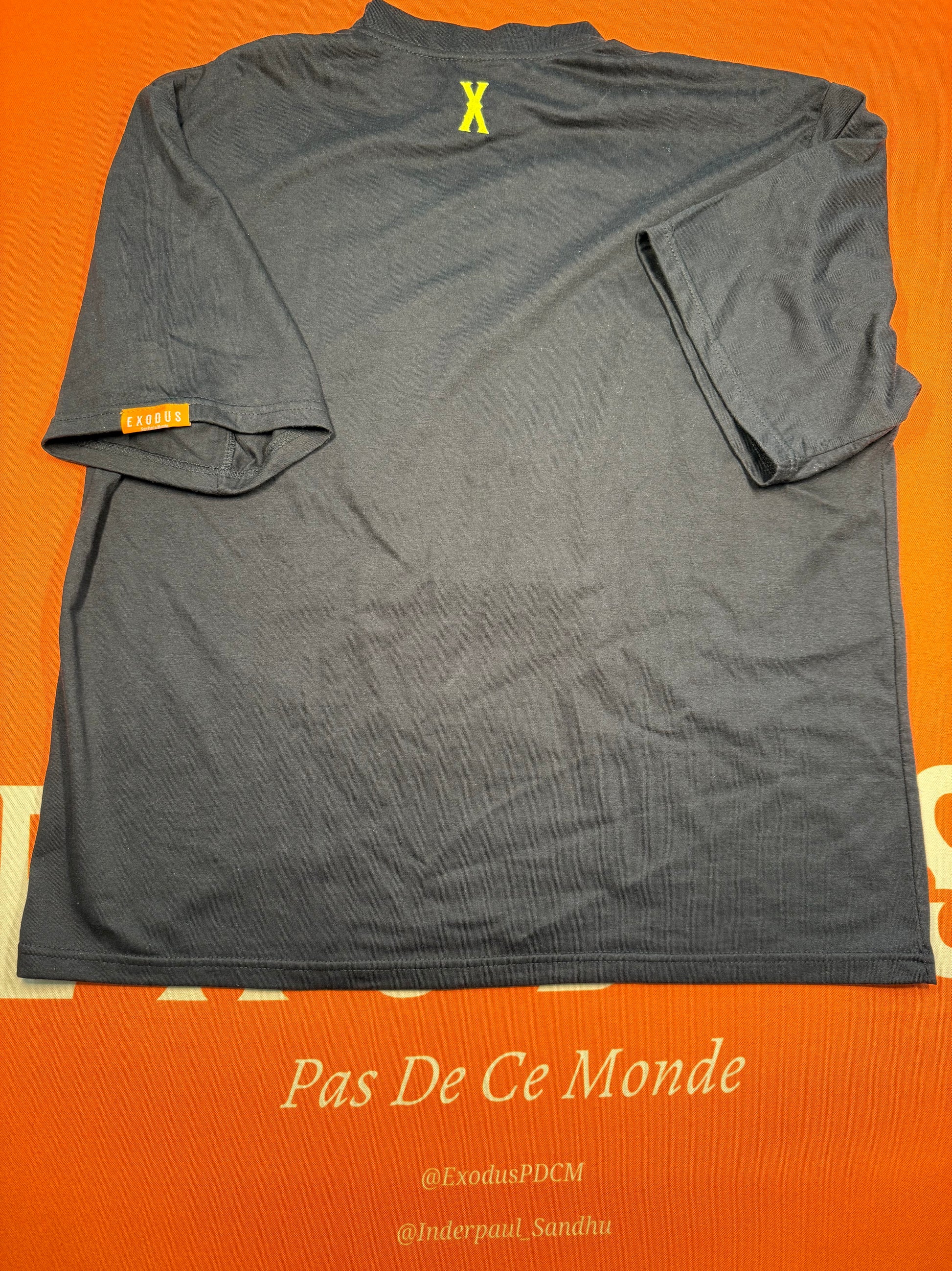 Clothing and accessories from Exodus Pas De Ce Monde – unisex streetwear including t-shirts, jackets, sunglasses, jewelry, bags, and headwear designed for everyday wear and bold urban fashion.
