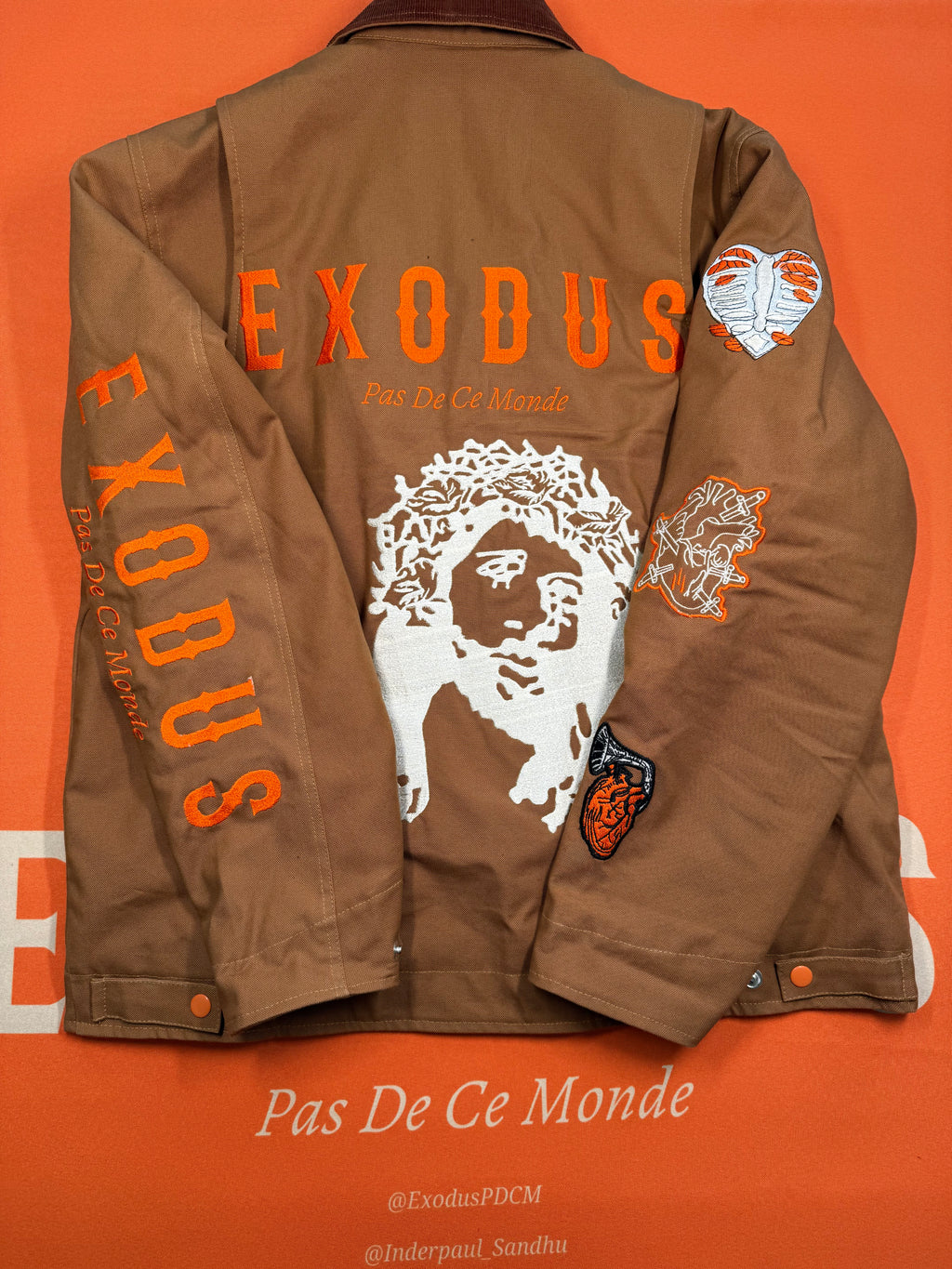 Clothing and accessories from Exodus Pas De Ce Monde – unisex streetwear including t-shirts, jackets, sunglasses, jewelry, bags, and headwear designed for everyday wear and bold urban fashion.