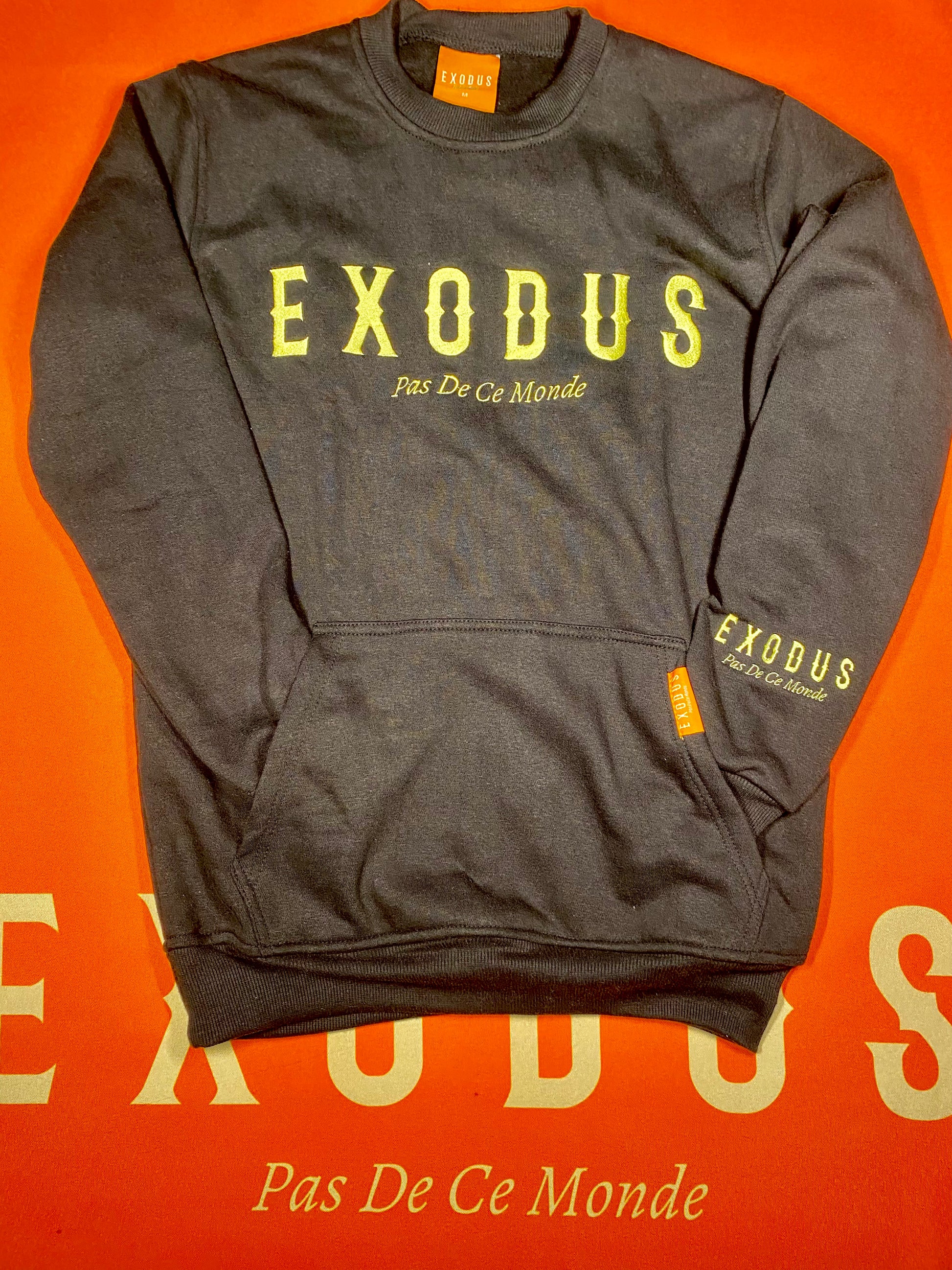 Clothing and accessories from Exodus Pas De Ce Monde – unisex streetwear including t-shirts, jackets, sunglasses, jewelry, bags, and headwear designed for everyday wear and bold urban fashion.