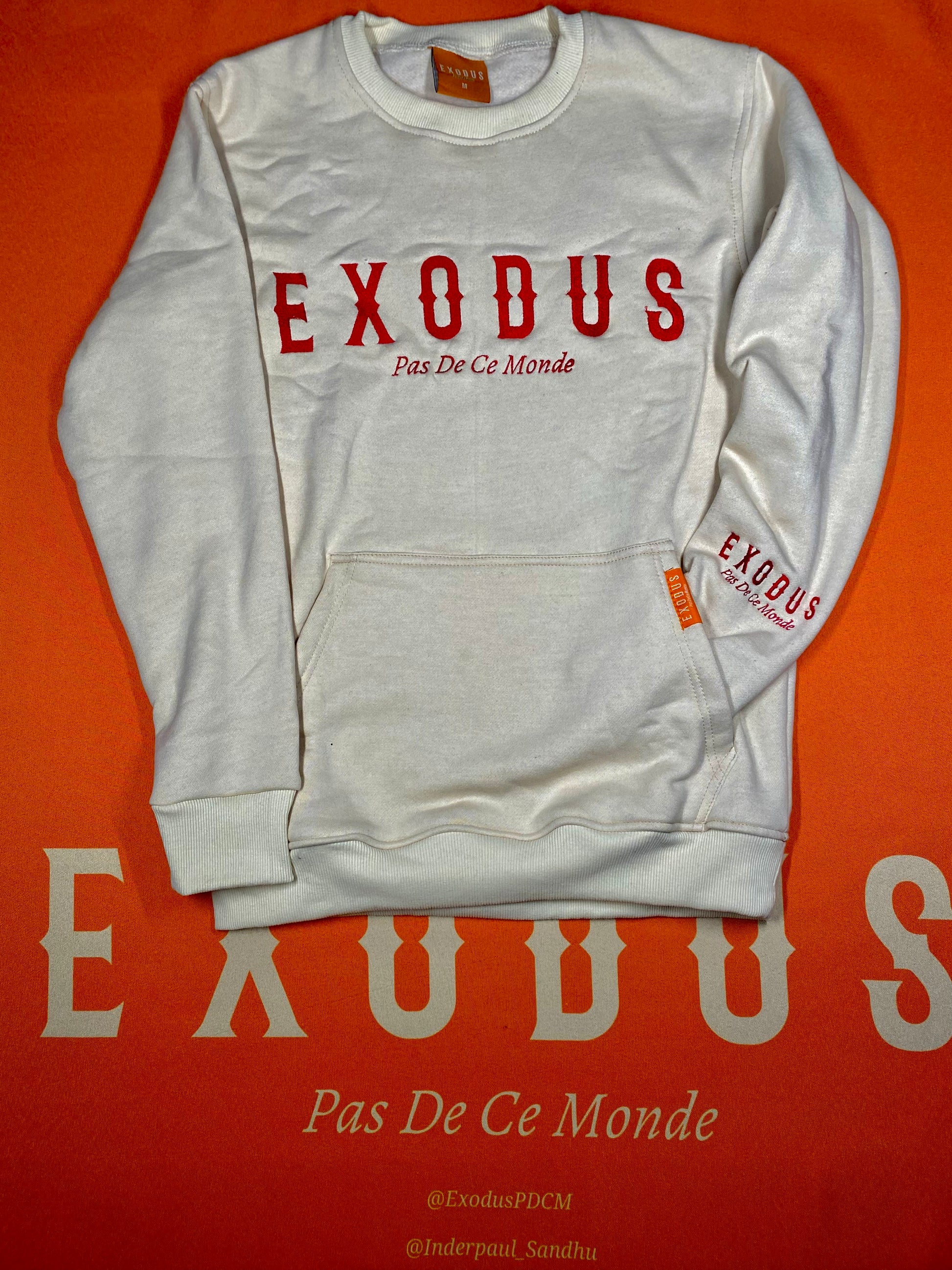 Clothing and accessories from Exodus Pas De Ce Monde – unisex streetwear including t-shirts, jackets, sunglasses, jewelry, bags, and headwear designed for everyday wear and bold urban fashion.