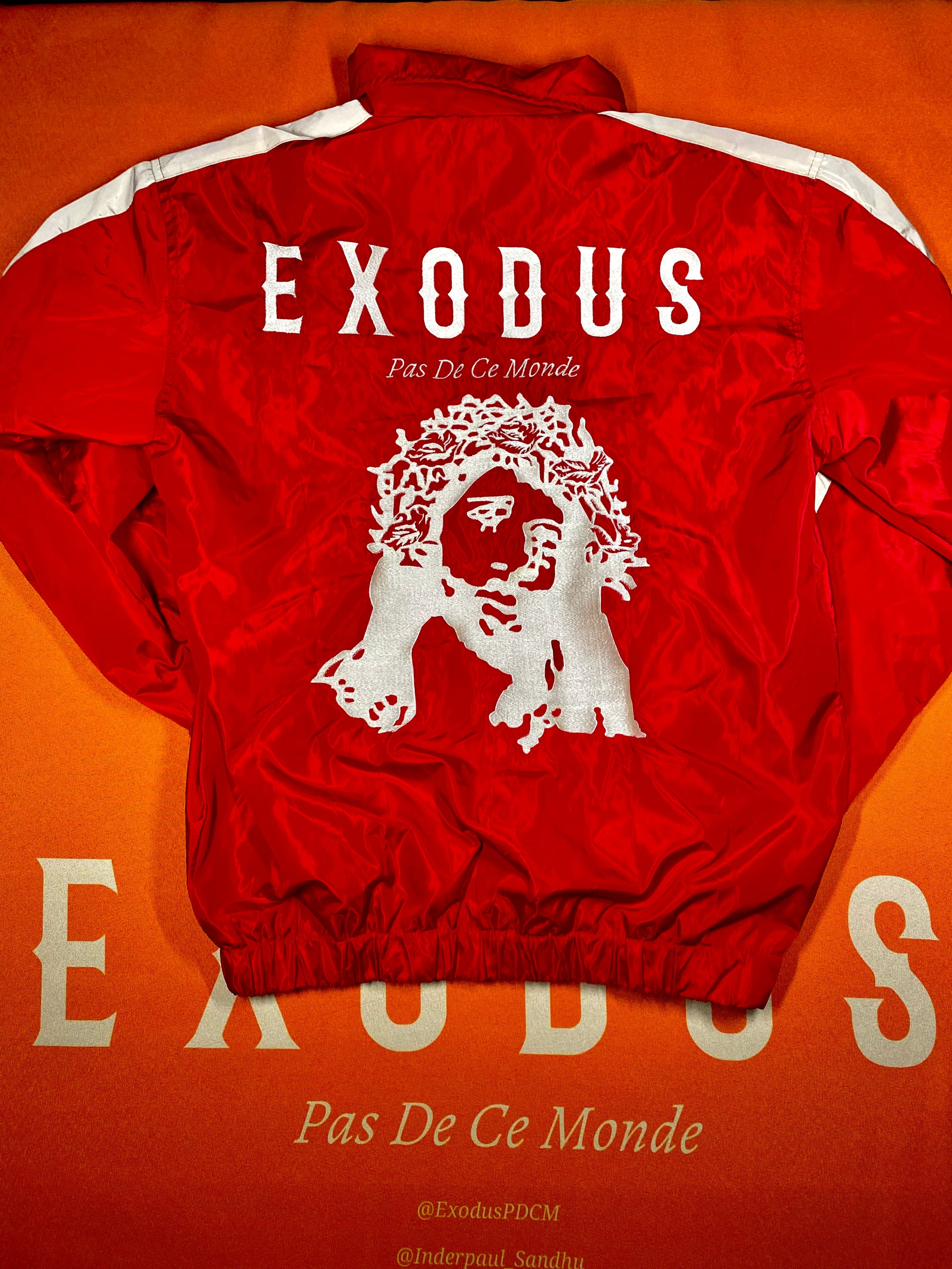 Clothing and accessories from Exodus Pas De Ce Monde – unisex streetwear including t-shirts, jackets, sunglasses, jewelry, bags, and headwear designed for everyday wear and bold urban fashion.