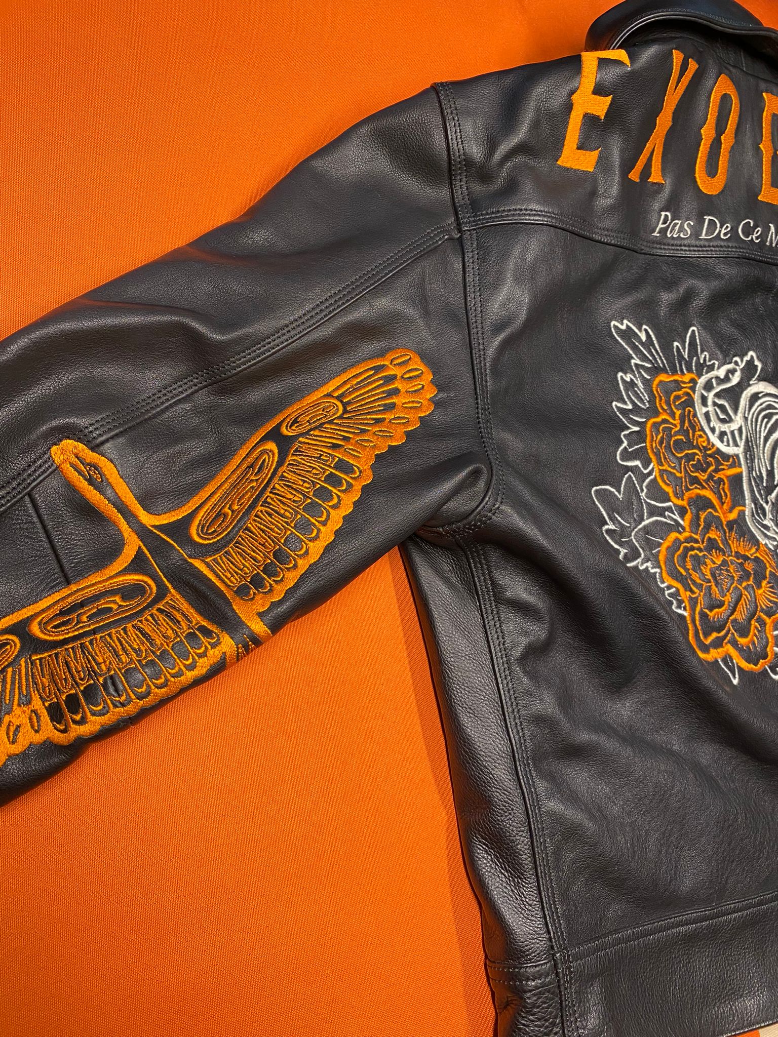 Clothing and accessories from Exodus Pas De Ce Monde – unisex streetwear including t-shirts, jackets, sunglasses, jewelry, bags, and headwear designed for everyday wear and bold urban fashion.