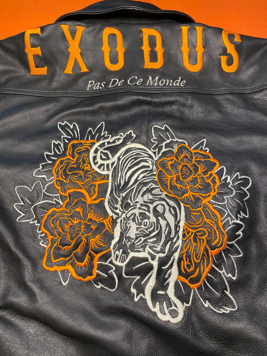 Clothing and accessories from Exodus Pas De Ce Monde – unisex streetwear including t-shirts, jackets, sunglasses, jewelry, bags, and headwear designed for everyday wear and bold urban fashion.