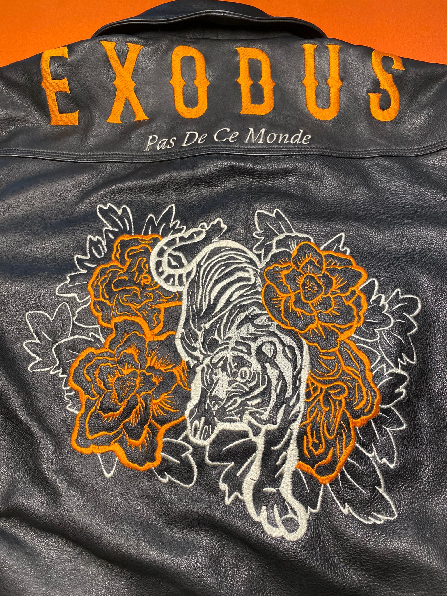 Clothing and accessories from Exodus Pas De Ce Monde – unisex streetwear including t-shirts, jackets, sunglasses, jewelry, bags, and headwear designed for everyday wear and bold urban fashion.