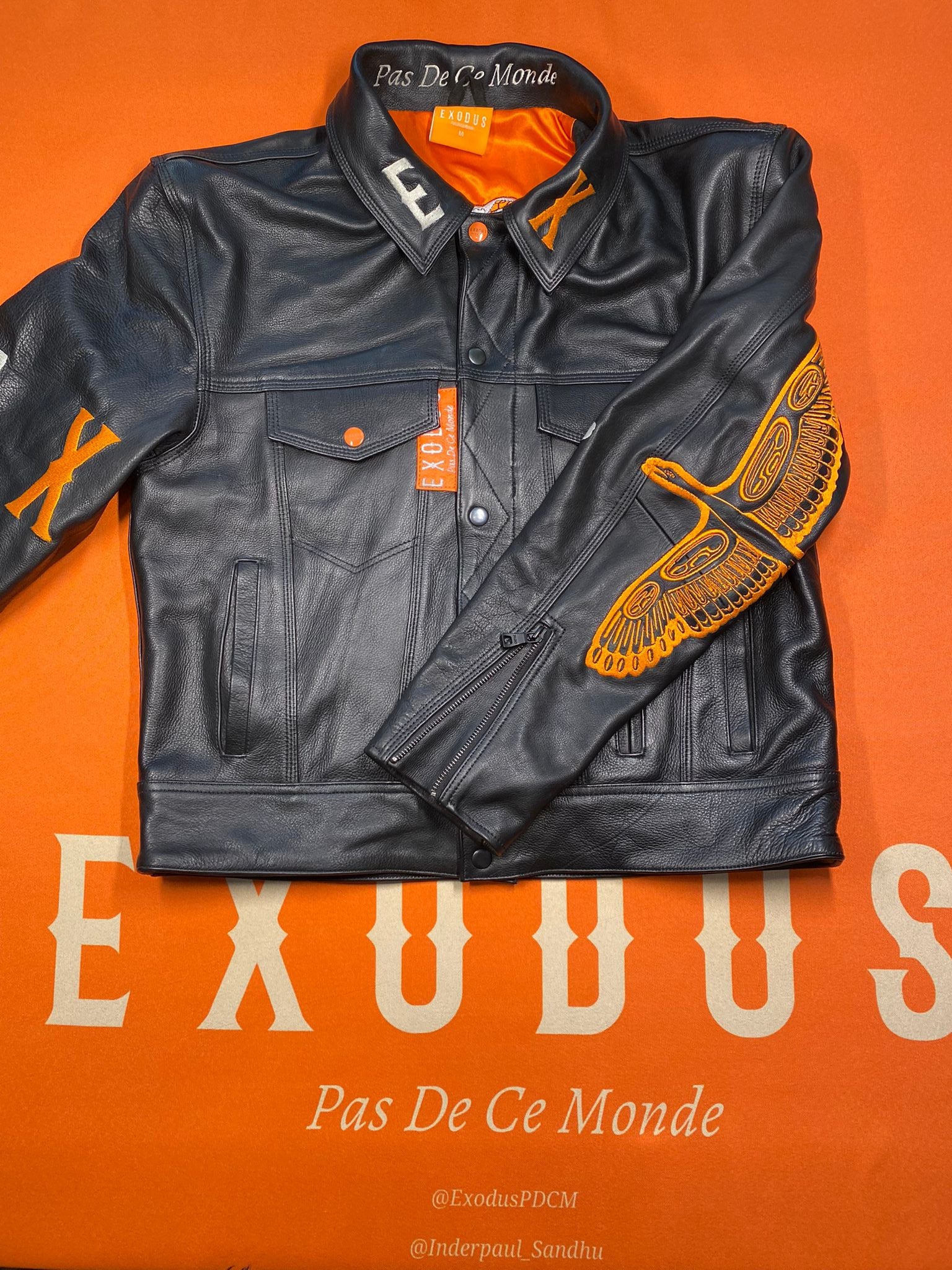 Clothing and accessories from Exodus Pas De Ce Monde – unisex streetwear including t-shirts, jackets, sunglasses, jewelry, bags, and headwear designed for everyday wear and bold urban fashion.