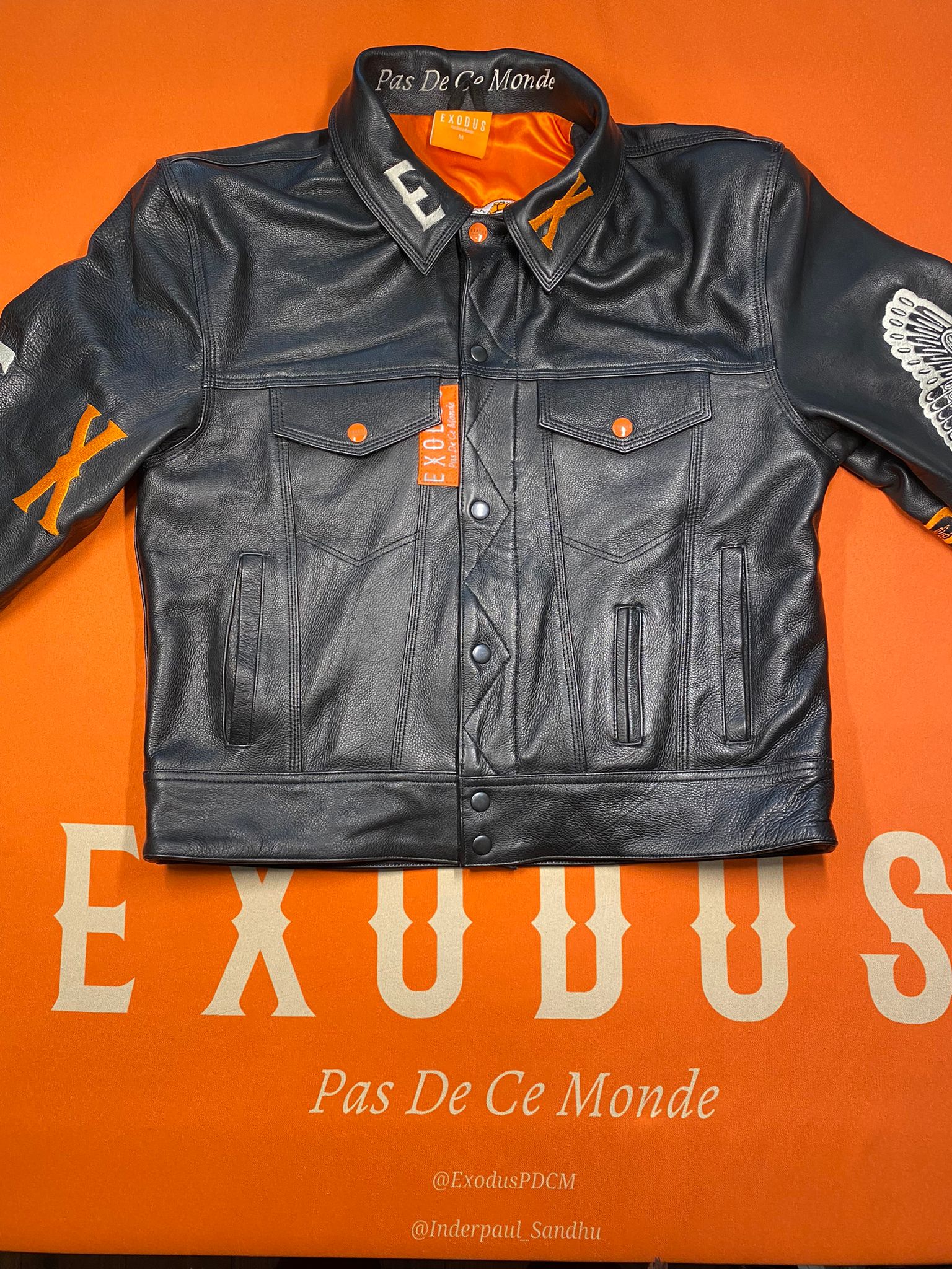 Clothing and accessories from Exodus Pas De Ce Monde – unisex streetwear including t-shirts, jackets, sunglasses, jewelry, bags, and headwear designed for everyday wear and bold urban fashion.