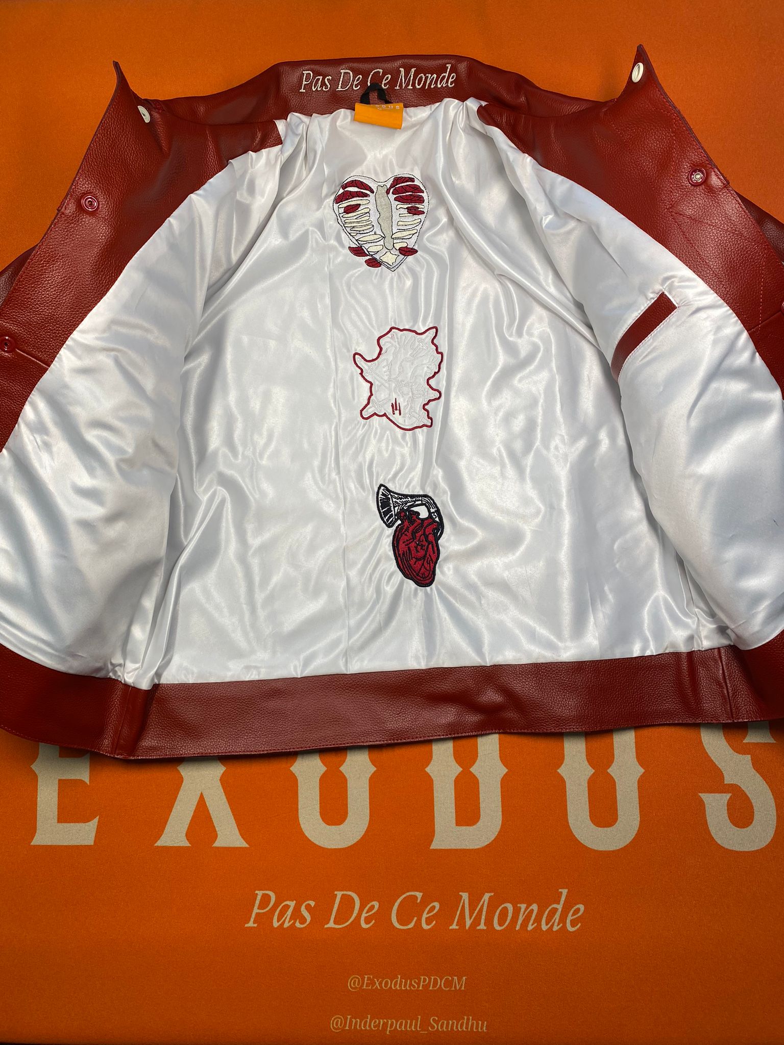 Clothing and accessories from Exodus Pas De Ce Monde – unisex streetwear including t-shirts, jackets, sunglasses, jewelry, bags, and headwear designed for everyday wear and bold urban fashion.