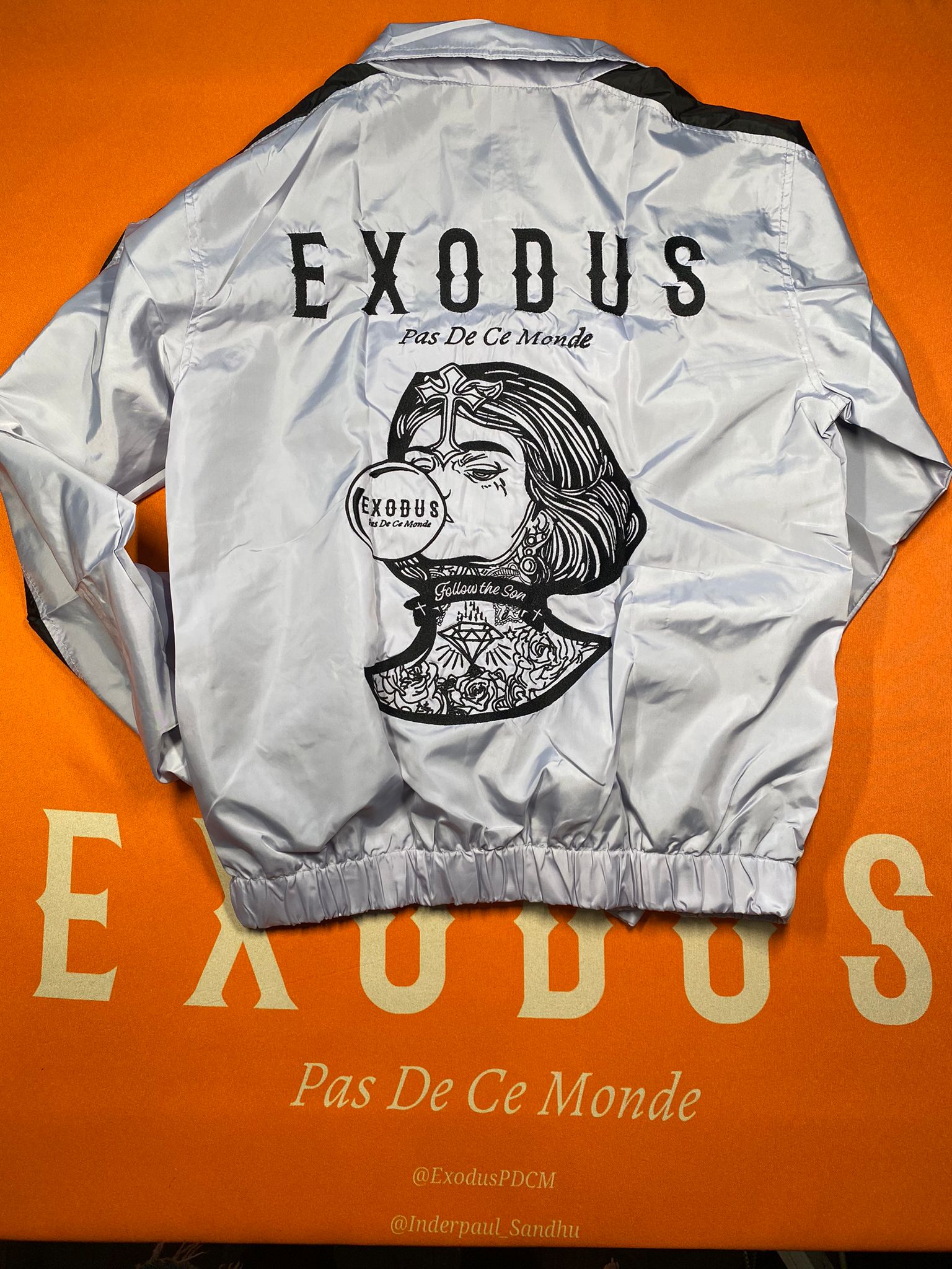Clothing and accessories from Exodus Pas De Ce Monde – unisex streetwear including t-shirts, jackets, sunglasses, jewelry, bags, and headwear designed for everyday wear and bold urban fashion.