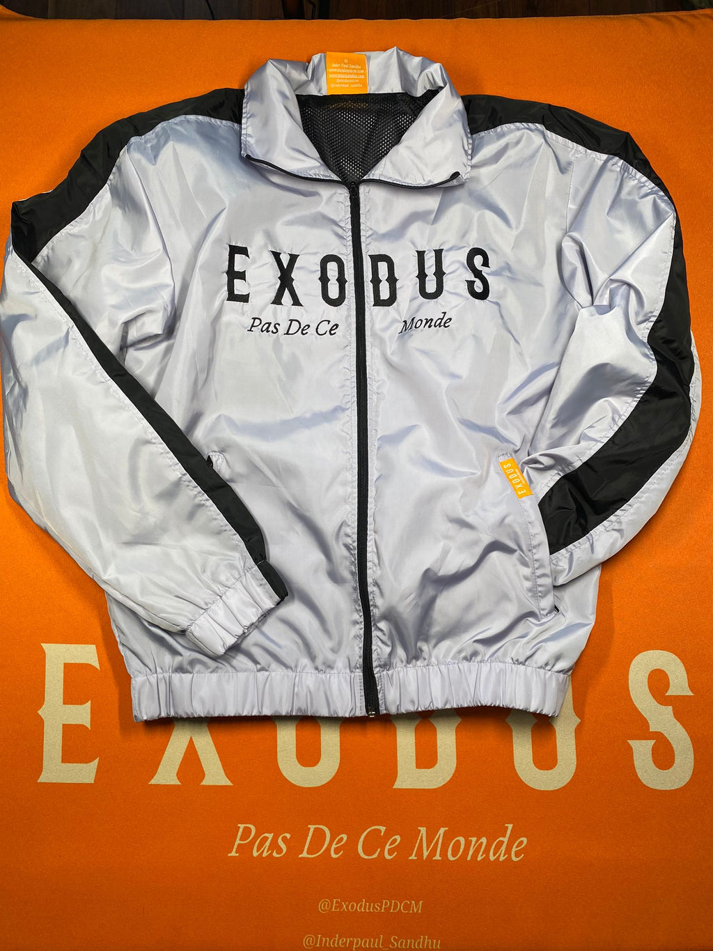 Clothing and accessories from Exodus Pas De Ce Monde – unisex streetwear including t-shirts, jackets, sunglasses, jewelry, bags, and headwear designed for everyday wear and bold urban fashion.