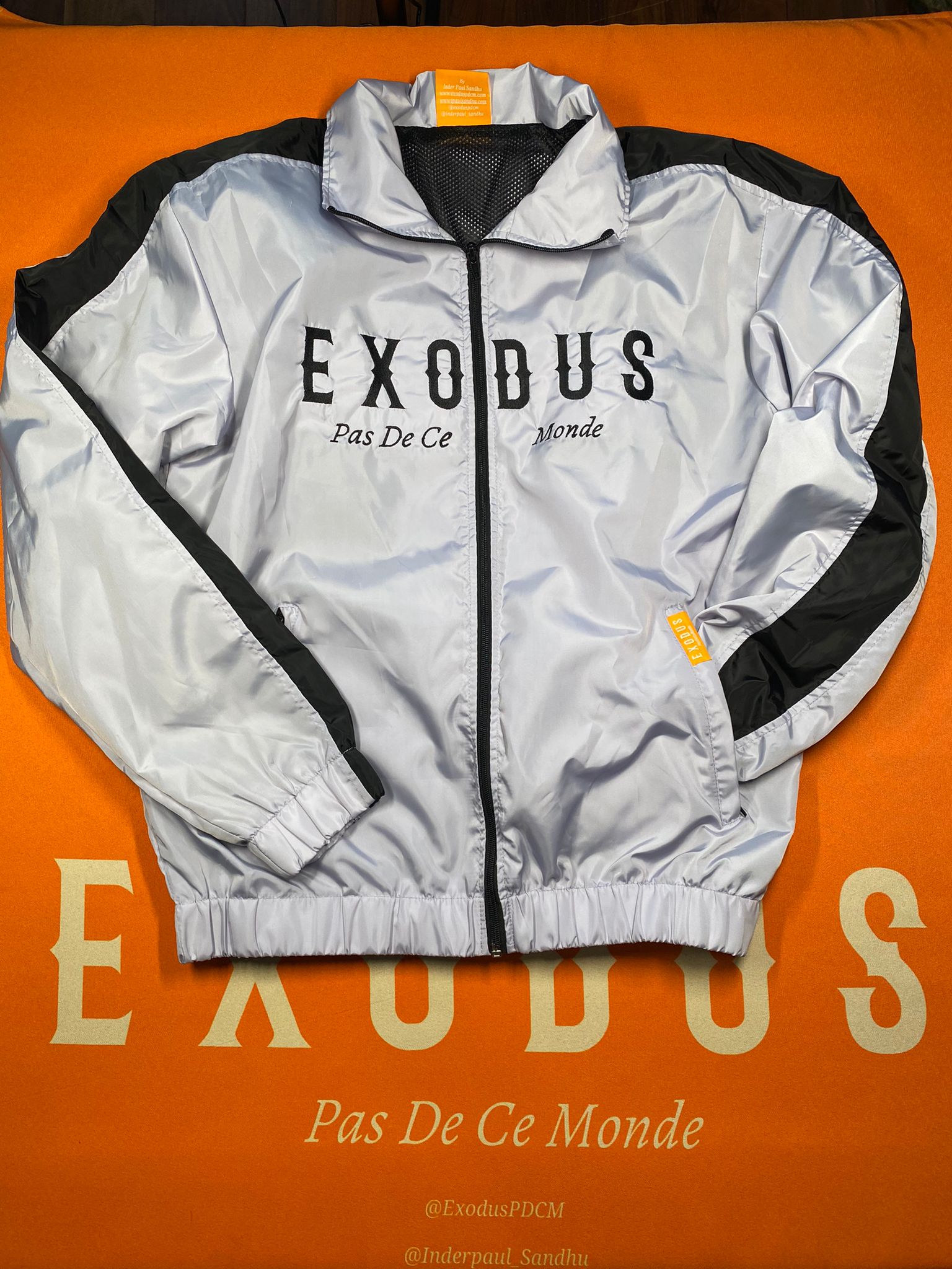 Clothing and accessories from Exodus Pas De Ce Monde – unisex streetwear including t-shirts, jackets, sunglasses, jewelry, bags, and headwear designed for everyday wear and bold urban fashion.