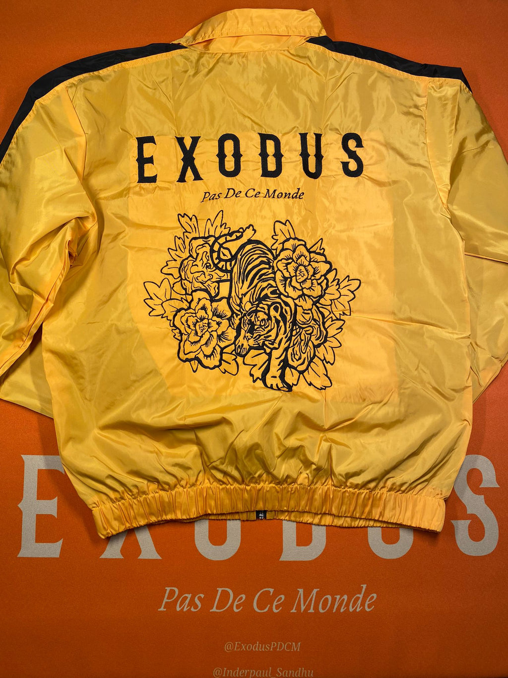 Clothing and accessories from Exodus Pas De Ce Monde – unisex streetwear including t-shirts, jackets, sunglasses, jewelry, bags, and headwear designed for everyday wear and bold urban fashion.