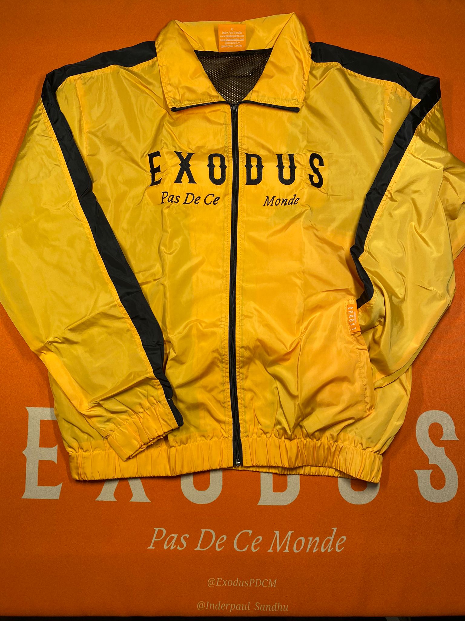 Clothing and accessories from Exodus Pas De Ce Monde – unisex streetwear including t-shirts, jackets, sunglasses, jewelry, bags, and headwear designed for everyday wear and bold urban fashion.