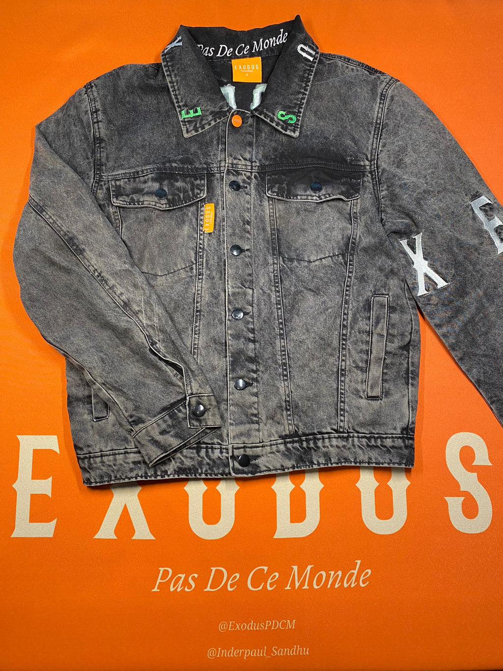 Clothing and accessories from Exodus Pas De Ce Monde – unisex streetwear including t-shirts, jackets, sunglasses, jewelry, bags, and headwear designed for everyday wear and bold urban fashion.
