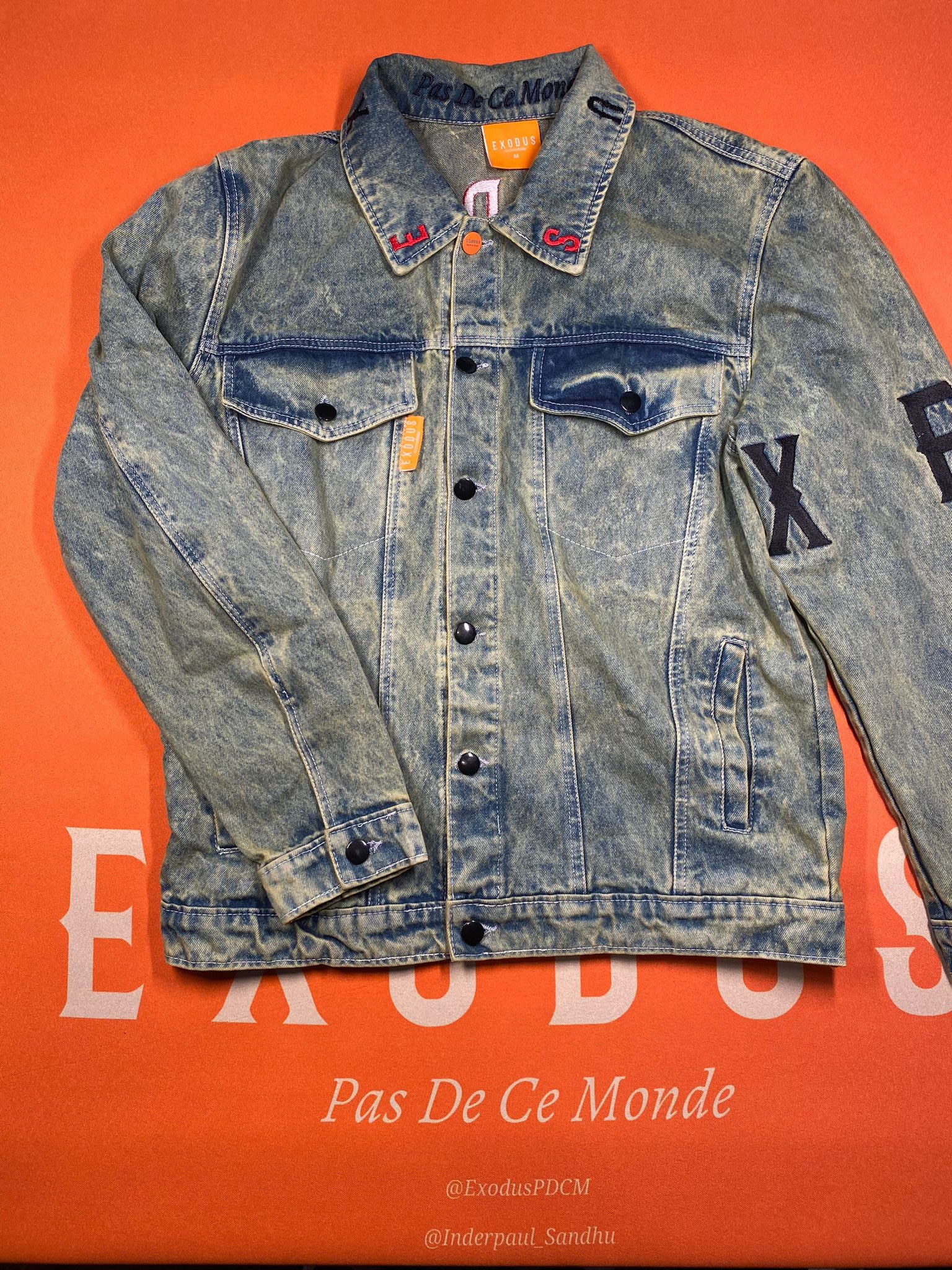 Clothing and accessories from Exodus Pas De Ce Monde – unisex streetwear including t-shirts, jackets, sunglasses, jewelry, bags, and headwear designed for everyday wear and bold urban fashion.
