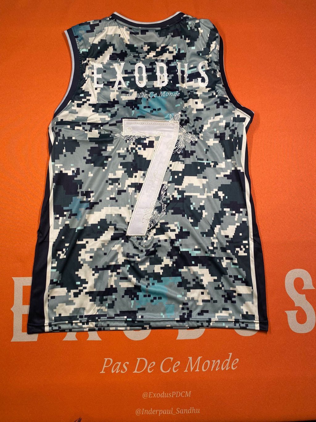 Clothing and accessories from Exodus Pas De Ce Monde – unisex streetwear including t-shirts, jackets, sunglasses, jewelry, bags, and headwear designed for everyday wear and bold urban fashion.